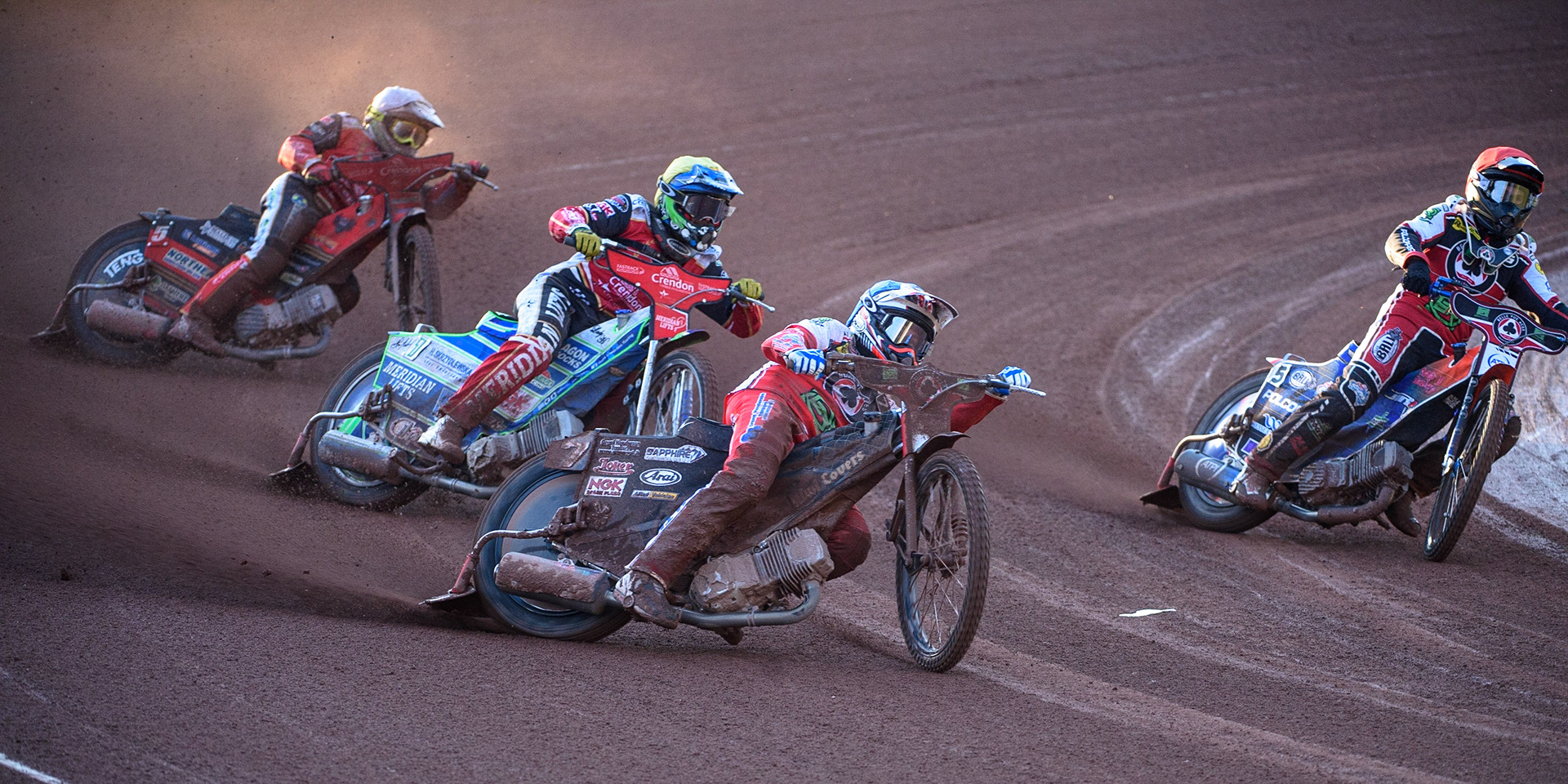 MANCHESTER, UK. AUG 9TH  Ricky Wells (Blue) outside Brady Kurtz  (Red) as they lead Hans Andersen (Yellow) and Chris Harris  (White) during the SGB Premiership match between Belle Vue Aces and Peterborough at the National Speedway Stadium, Manchester on Monday 9th August 2021. (Credit: Ian Charles | MI News)