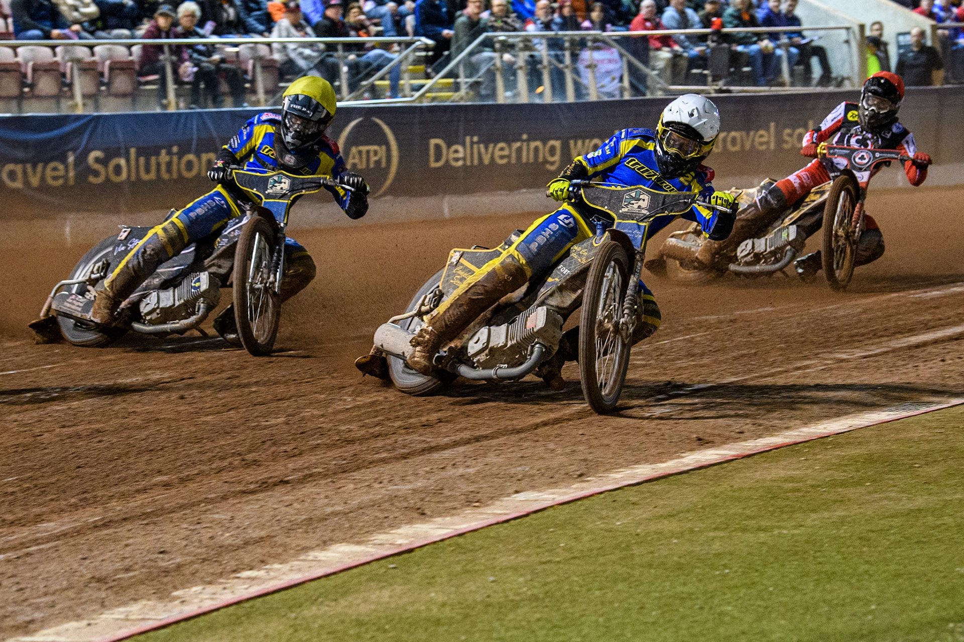 Sheffield Tigers' Kyle Howarth  in White and Sheffield Tigers' Dan Gilkes  in Yellow leading Belle Vue Aces' Norick Blodorn  in Red during the Rowe Motor Oil Premiership Play Off Semi Final 2, 1st Leg match between Belle Vue Aces and Sheffield Tigers at the National Speedway Stadium, Manchester on Monday 16th September 2024. (Photo: Ian Charles | MI News)