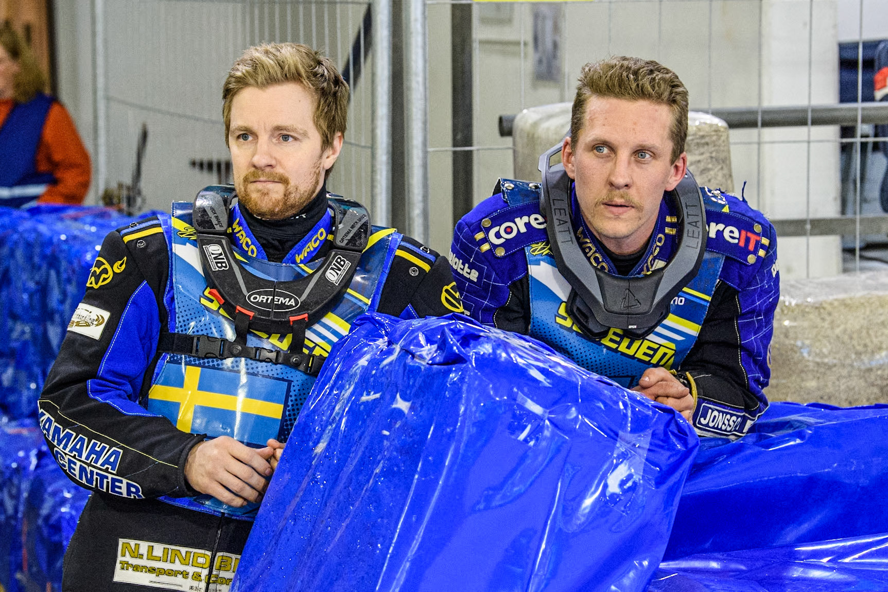 Sweden's Martin Haarahiltunen (199)  (Left) and Sweden's Jimmy Hörnell Lidfalk (237) watch the track prep between heats during the FIM Ice Speedway Gladiators World Championship Final 4 at Ice Rink Thialf, Heerenveen on Sunday 7th April 2024. (Photo: Ian Charles | MI News)