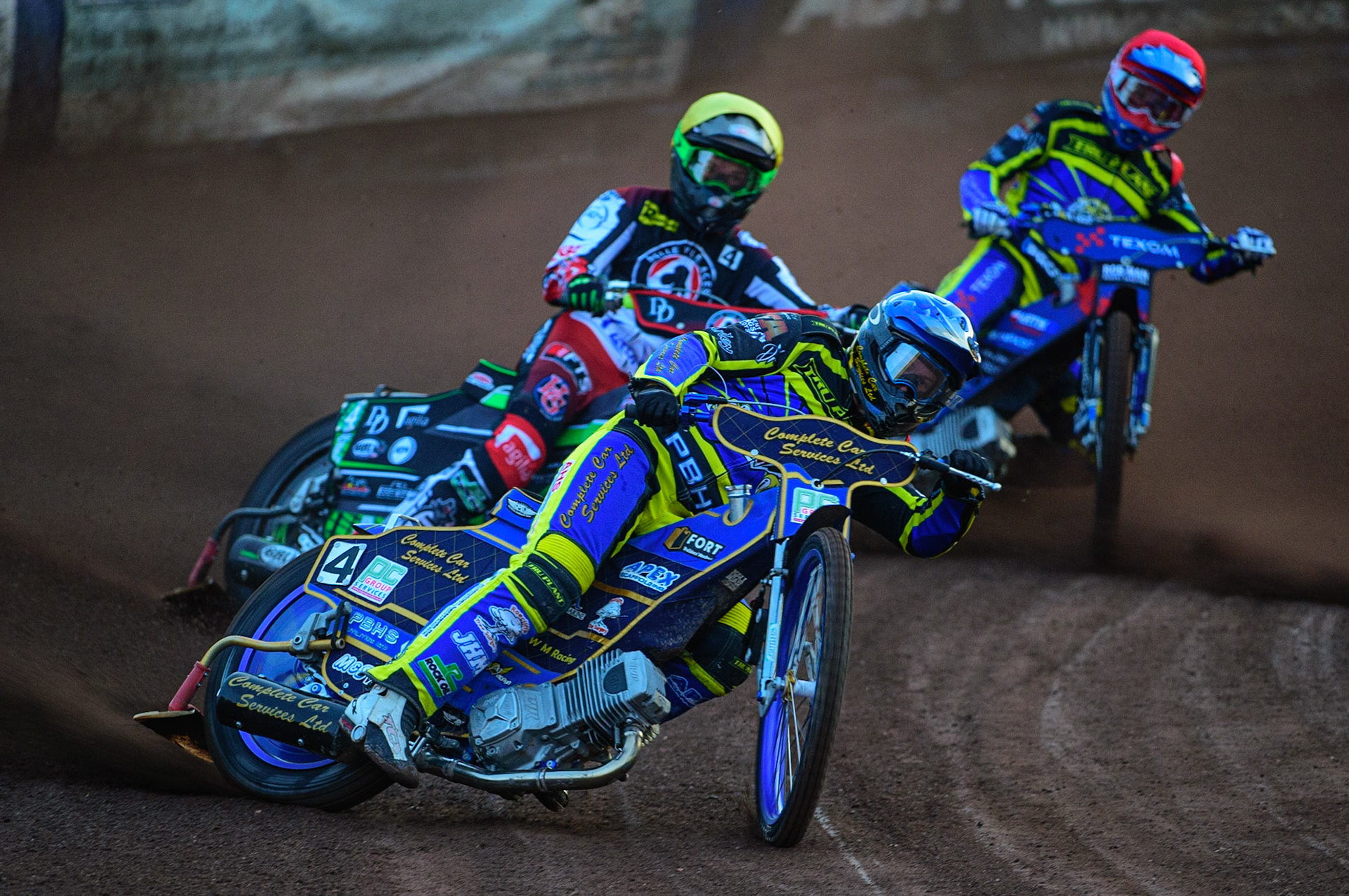 SHEFFIELD, UK. APR 14TH  Kyle Howarth  (Blue) leads Charles Wright  (Yellow) and Tobiasz Musielak  (Red) during the SGB Premiership League Cup match between Sheffield Tigers and Belle Vue Aces at Owlerton Stadium, Sheffield on Thursday 14th April 2022. (Credit: Ian Charles | MI News)