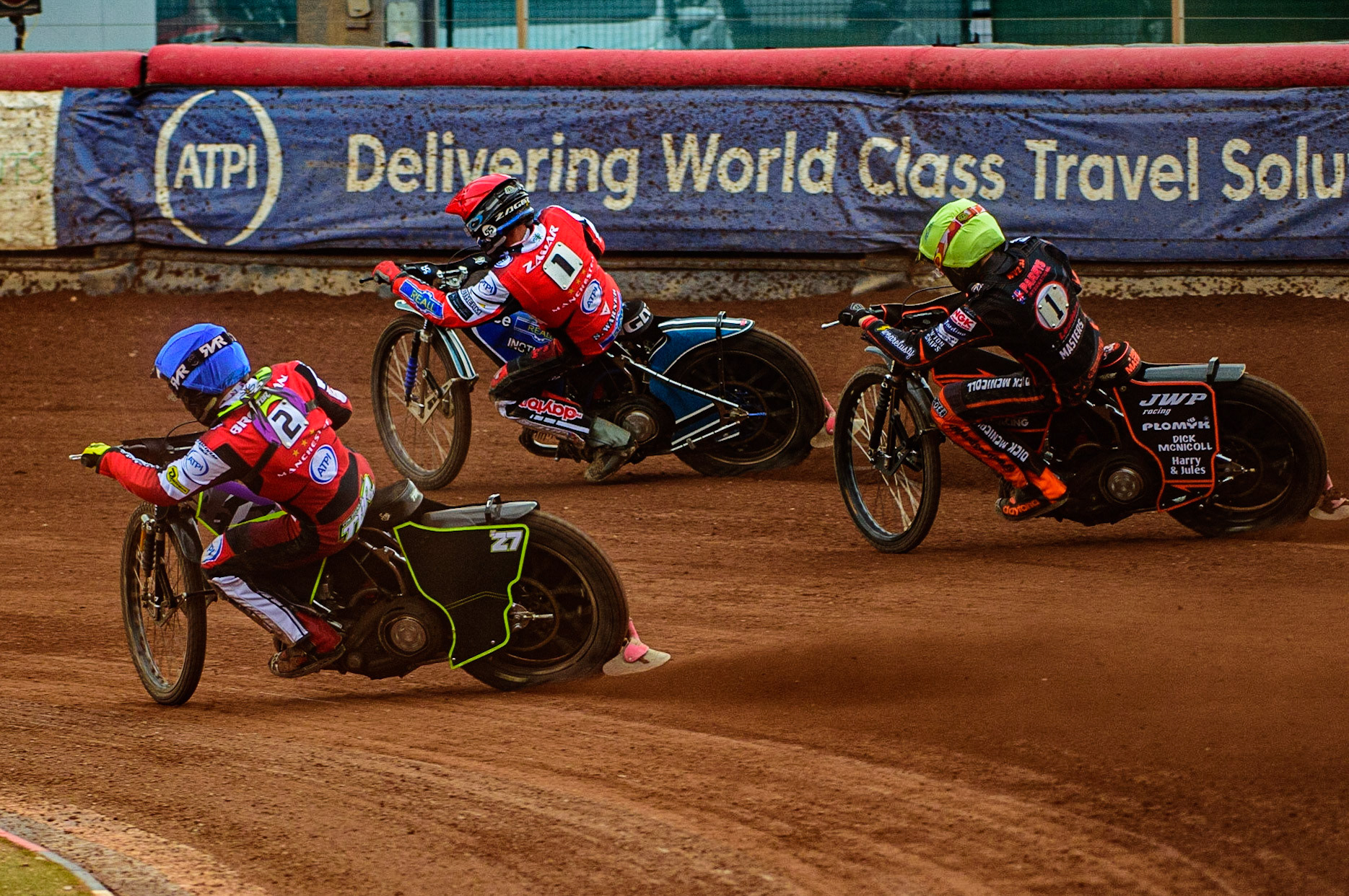 Tom Brennan  (Blue) and Matej Zagar  (Red) lead Sam Masters  (Yellow) during the SGB Premiership match between Belle Vue Aces and Wolverhampton Wolves at the National Speedway Stadium, Manchester on Monday 29th August 2022. (Credit: Ian Charles | MI News)