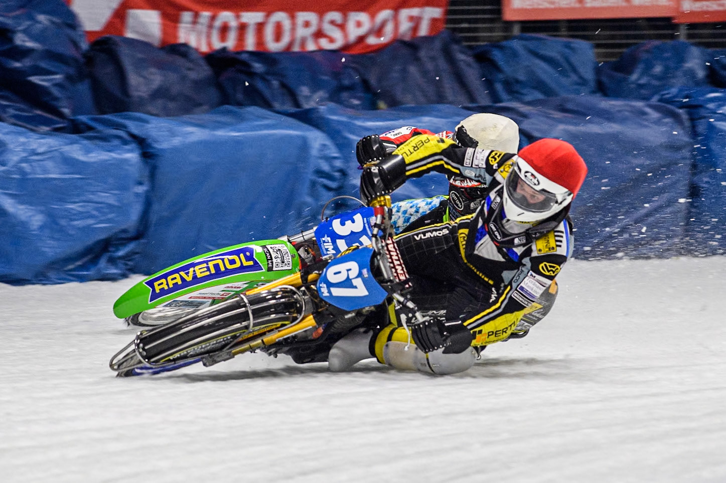 Finland's Heikki Huusko (67) (Red) passes Germany's Johann Weber (33) (White) during the FIM Ice Speedway Gladiators World Championship Final 1 at the Max-Aicher-Arena, Inzell on Saturday 23 March 2024. (Photo: Ian Charles | MI News)