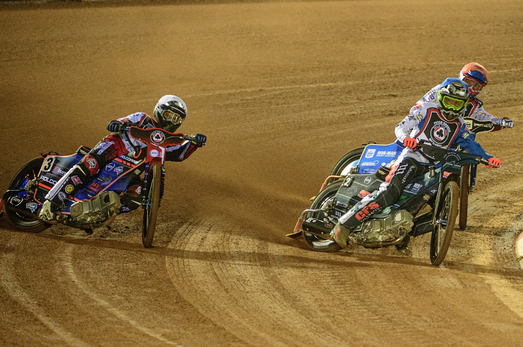 MANCHESTER, UK. MAR 21ST. Adam Ellis  (Blue) inside Brady Kurtz (White) with Tobiasz Musielak (Red) behind during the ATPI Peter Craven Memorial Trophy at the National Speedway Stadium, Manchester on Monday 21st March 2022. (Credit: Ian Charles | MI News)