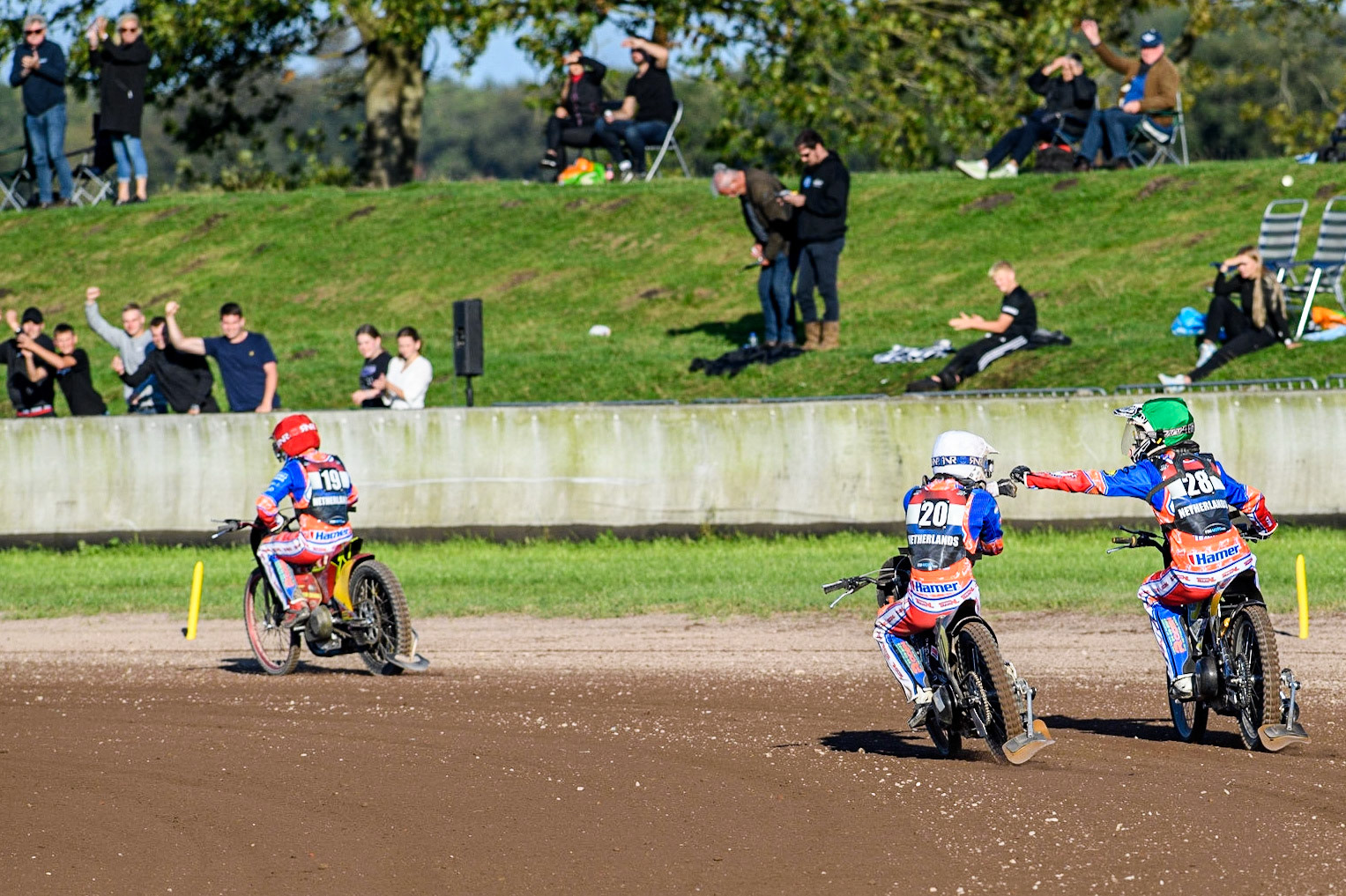 Netherlands riders Dave Meijerink (White) and Mika Meijer celebrate their win over Denmark during the FIM Long Track Of Nations event at the Speed Centre Roden on Sunday 24th September 2023. (Photo: Ian Charles | MI News)
