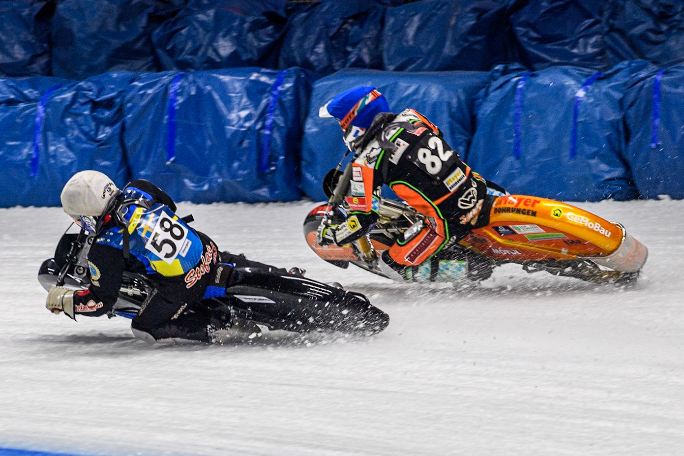 Sweden's Stefan Svensson (58) (White) inside Germany's Markus Jell (82) (Blue) during the FIM Ice Speedway Gladiators World Championship Final 1 at the Max-Aicher-Arena, Inzell on Saturday 23 March 2024. (Photo: Ian Charles | MI News)
