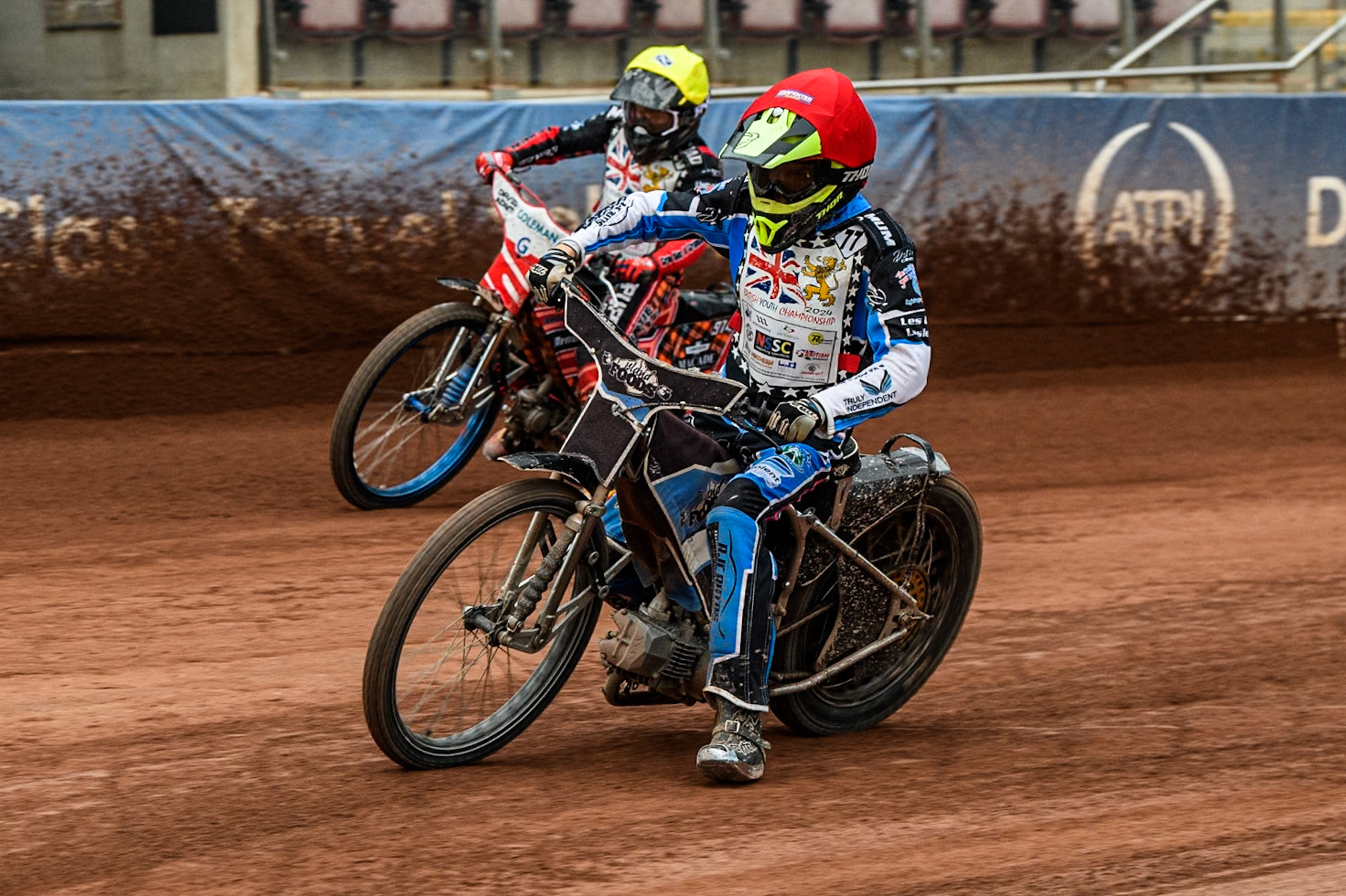 Jack Scully-Syer (125cc) in Red leading Rhys Harrow (125cc)  in Yellow during the British Youth 500cc Championships at the National Speedway Stadium, Manchester on Friday 2nd August 2024. (Photo: Ian Charles | MI News)