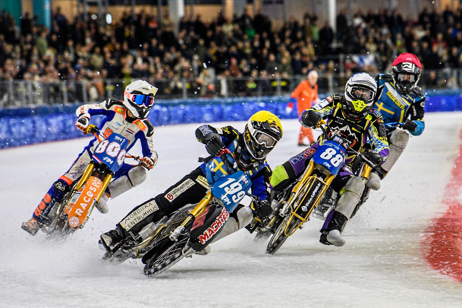 Martin Haarahiltunen (199) of Sweden in Yellow leading Max Niedermaier  (88) of Germany in Blue Jasper Iwema (800) of The Netherlands in White and Filip Jäger (719) of Sweden in Red into the first turn during the FIM Ice Speedway Gladiators World Championship, Final 4 at the Ice Stadium, Thialf, Heerenveen on Sunday 6th April 2025. (Photo: Ian Charles | MI News)