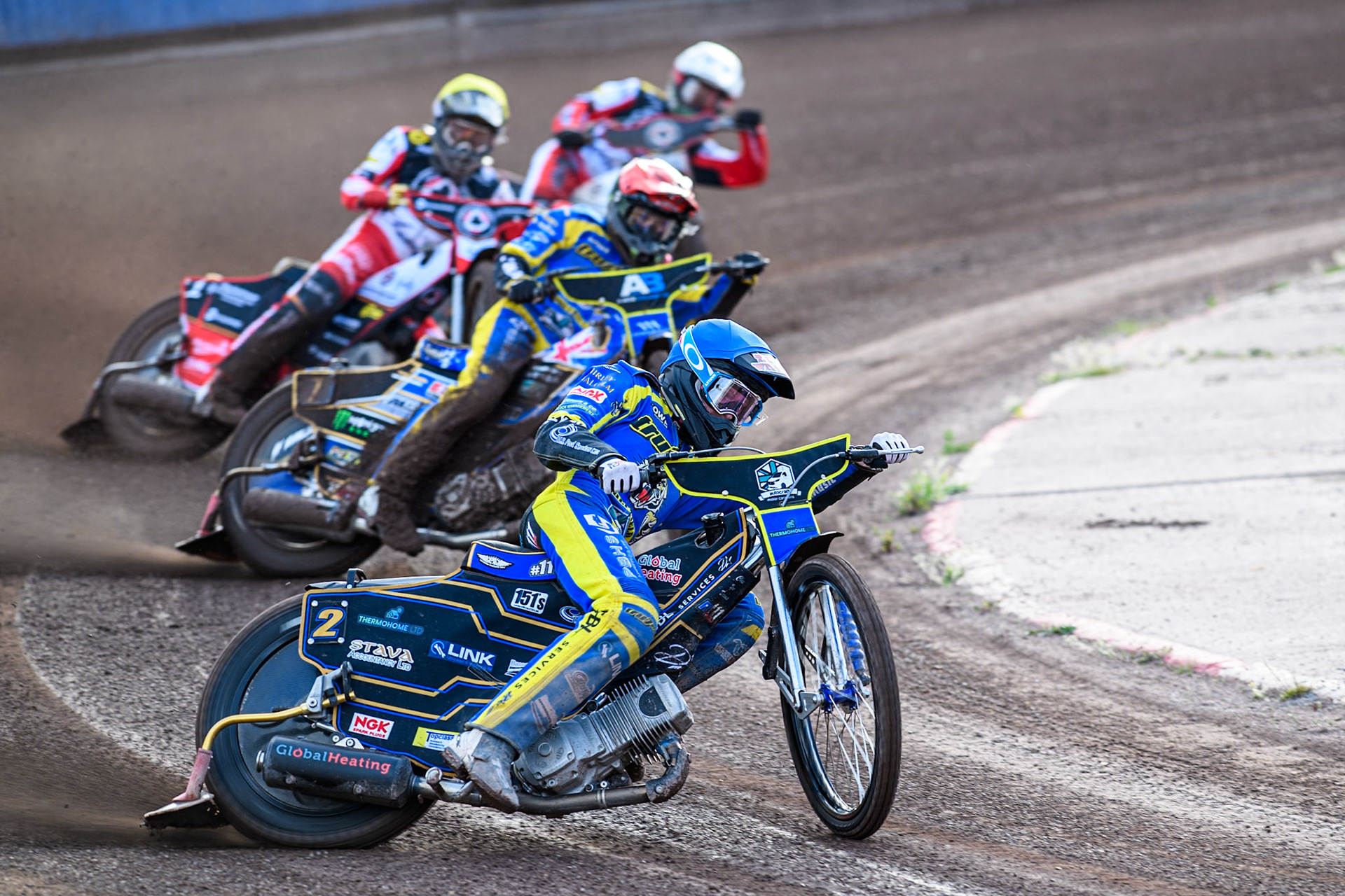 Anders Rowe of Sheffield Tigers in Blue leading Jack Holder of Sheffield Tigers in Red Brady Kurtz of Belle Vue Aces in White and Norick Blödorn of Belle Vue Aces in Blue during the Rowe Motor Oil Premiership match between Sheffield Tigers and Belle Vue Aces at Owlerton Stadium, Sheffield on Monday 5th May 2025. (Photo: Ian Charles | MI News)