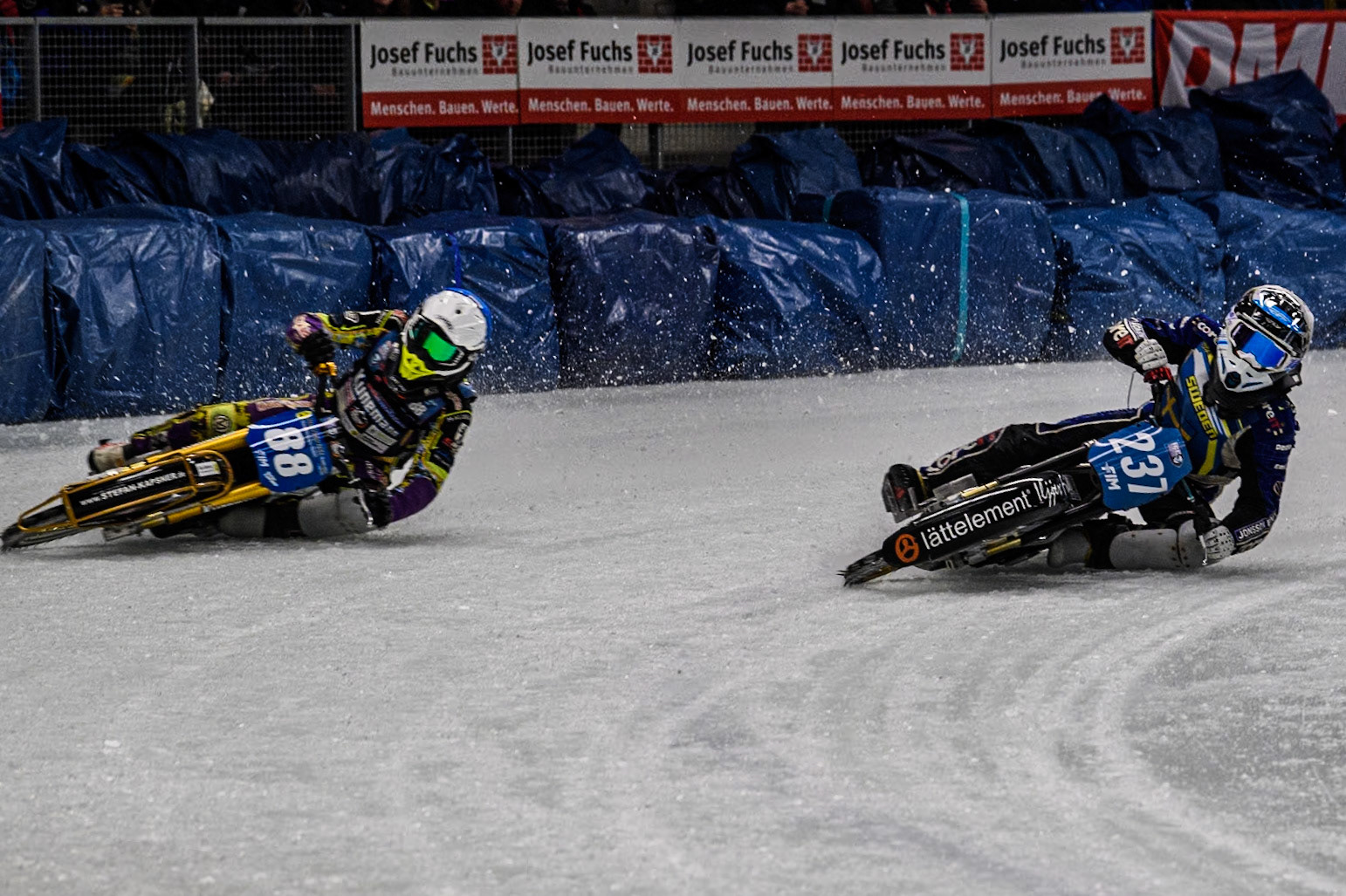 Sweden's Jimmy Hörnell Lidfalk (237) (Blue) inside Germany's Max Niedermaier (88) (White) during the FIM Ice Speedway Gladiators World Championship Final 1 at the Max-Aicher-Arena, Inzell on Saturday 23 March 2024. (Photo: Ian Charles | MI News)