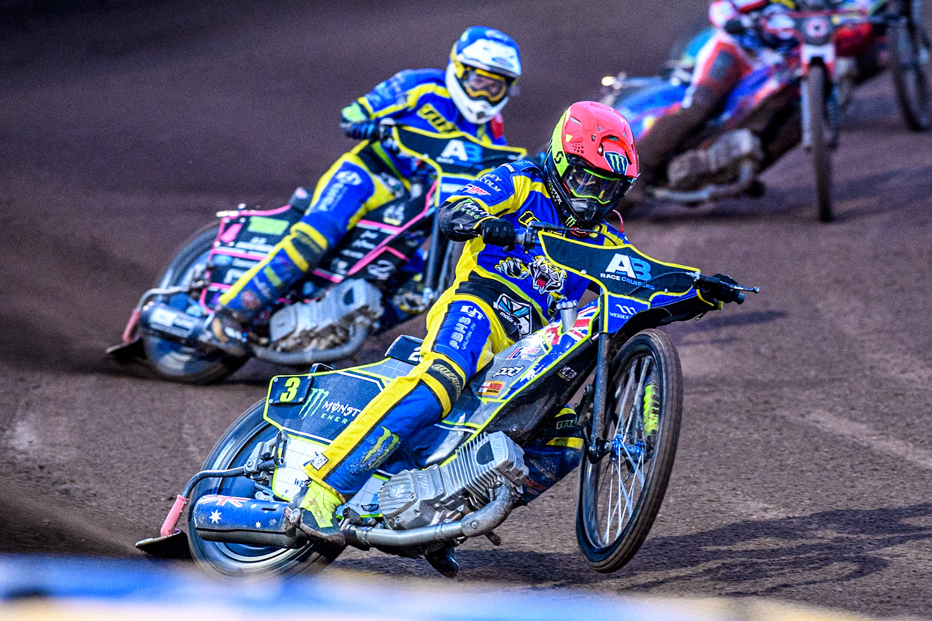 Sheffield Tigers' Chris Holder  in Red leading Sheffield Tigers' Josh Pickering  in Blue during the Rowe Motor Oil Premiership match between Sheffield Tigers and Belle Vue Aces at Owlerton Stadium, Sheffield on Monday 26th August 2024. (Photo: Ian Charles | MI News)