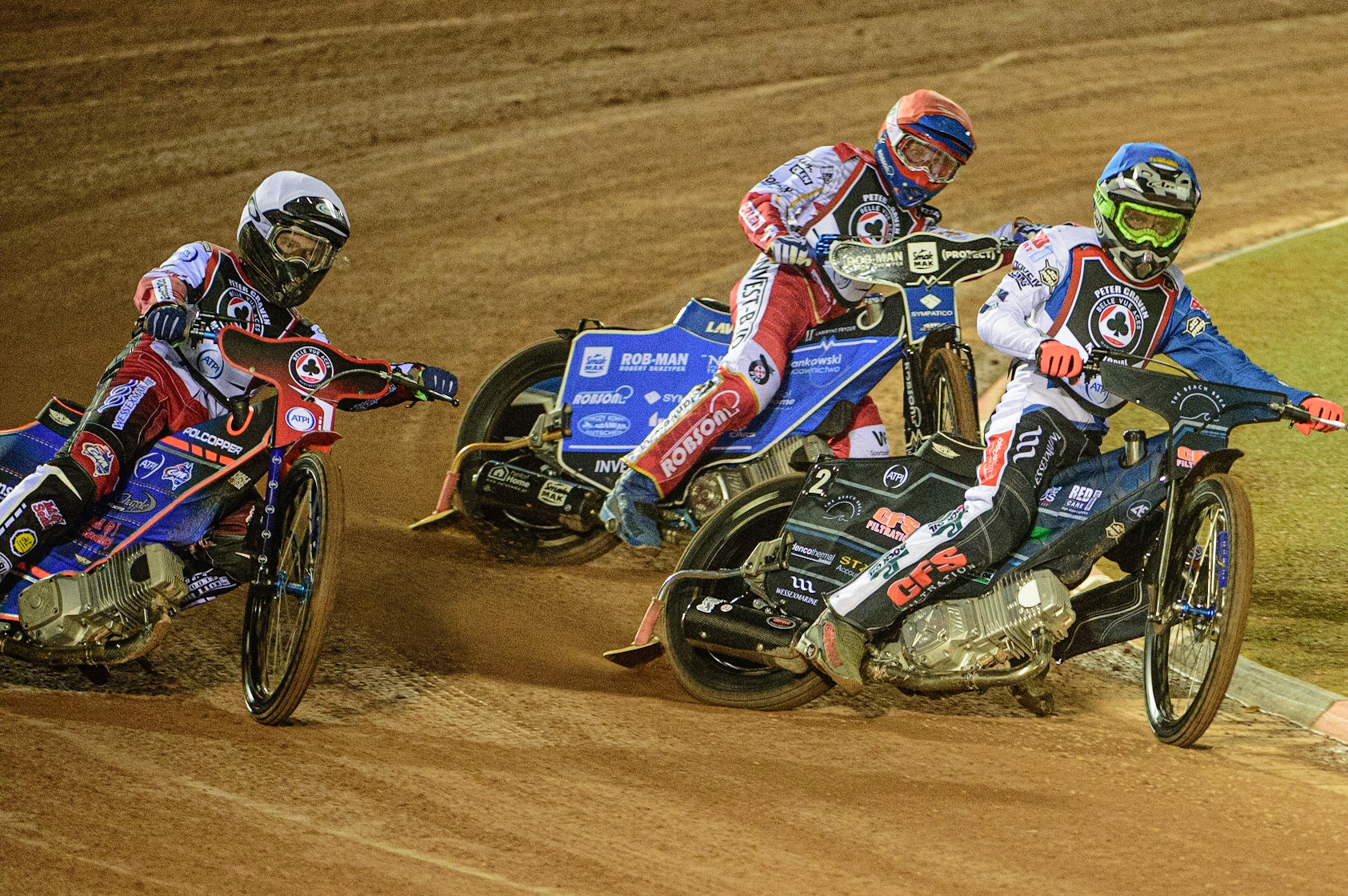 MANCHESTER, UK. MAR 21ST. Adam Ellis  (Blue) inside Brady Kurtz (White) with Tobiasz Musielak (Red) behind during the ATPI Peter Craven Memorial Trophy at the National Speedway Stadium, Manchester on Monday 21st March 2022. (Credit: Ian Charles | MI News)