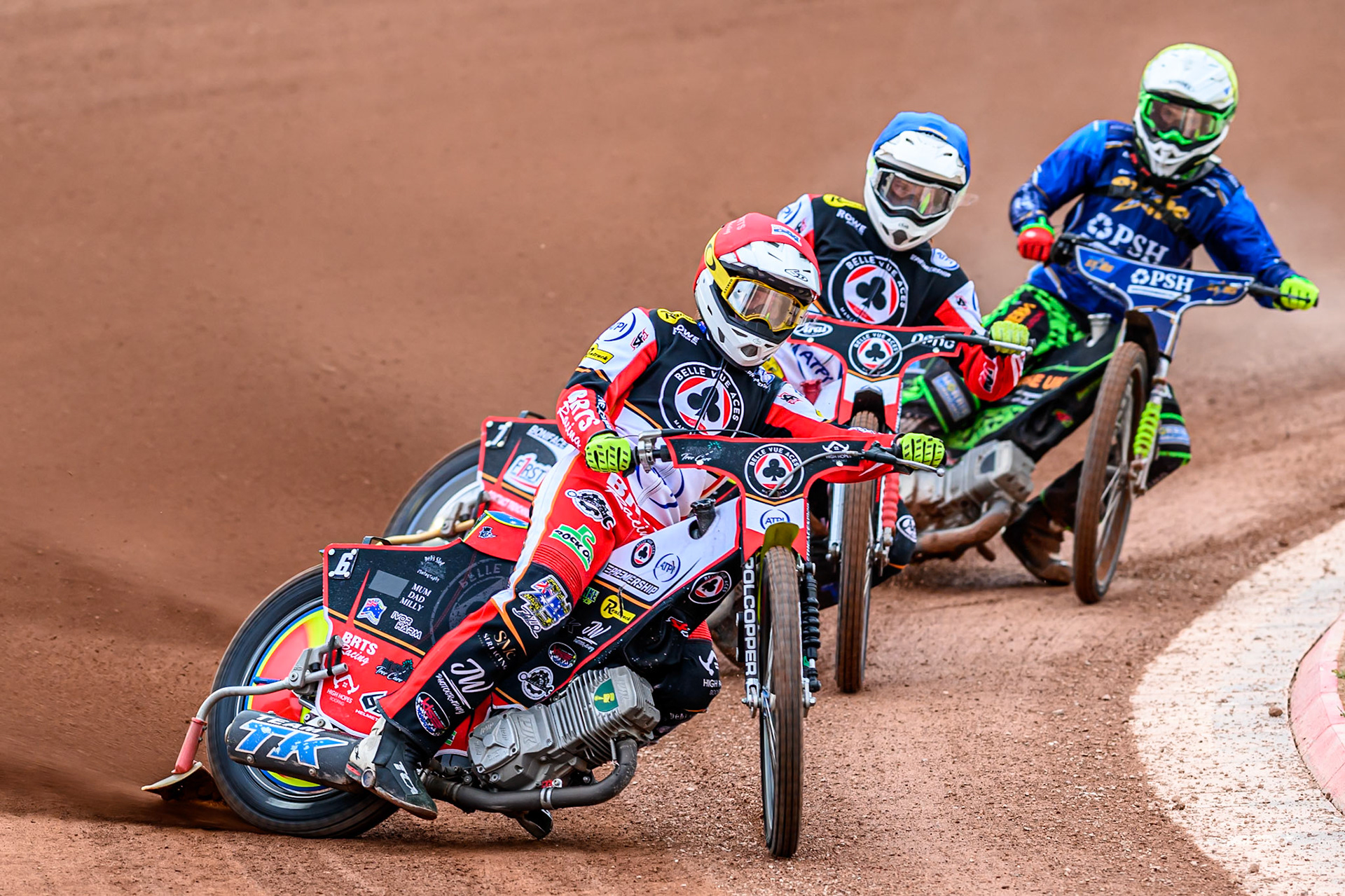 Belle Vue Aces' Tate Zischke in Red leading Belle Vue Aces' Jake Mulford in Blue and Kings Lynn Stars' Luke Harrison in Yellow during the Rowe Motor Oil Premiership match between Belle Vue Aces and King's Lynn Stars at the National Speedway Stadium, Manchester on Monday 23rd June 2025. (Photo: Ian Charles | MI News)