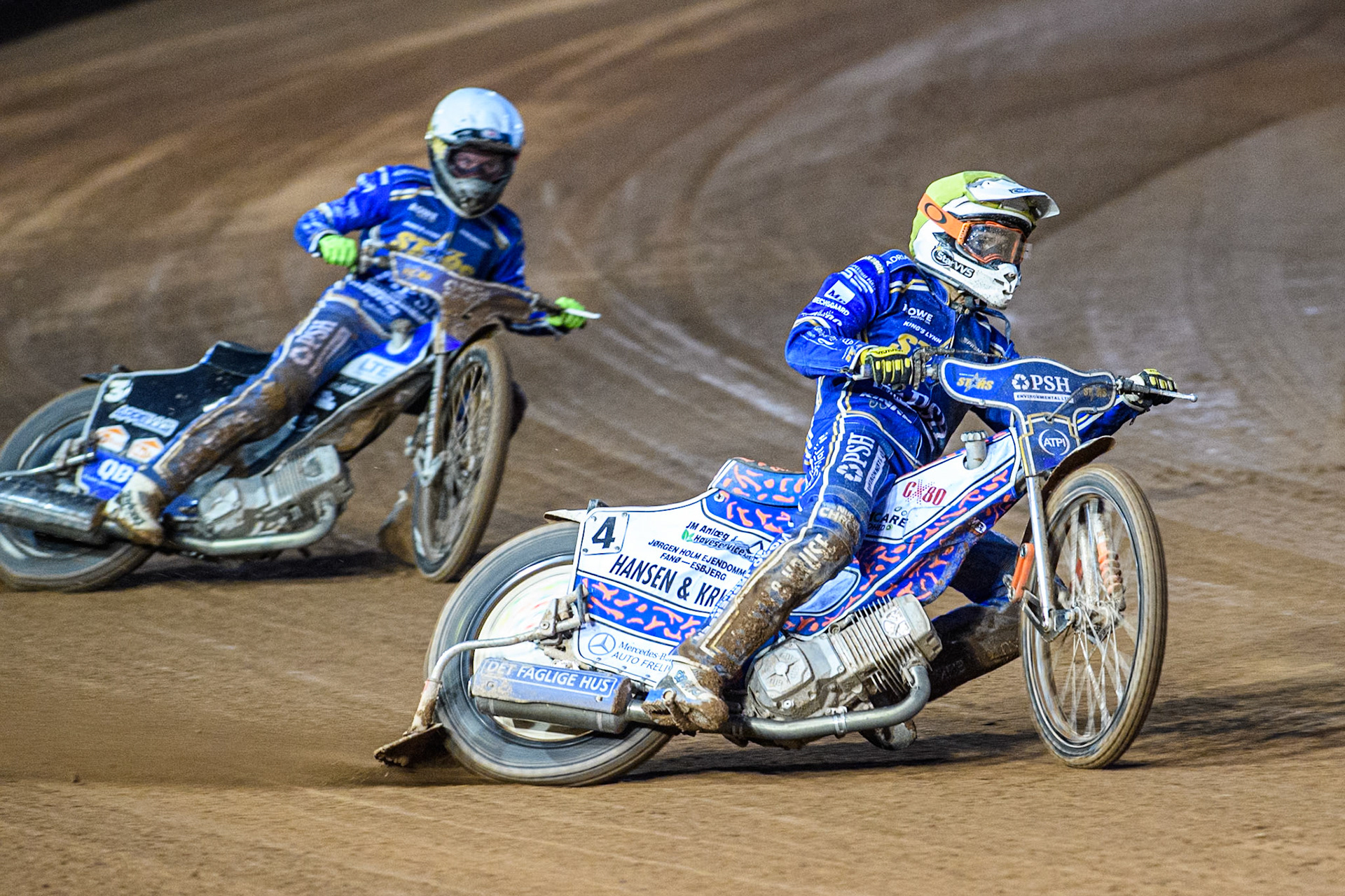 Niels-Kristian Iversen of Kings Lynn Stars in Yellow leading team mate Nicolai Klindt in White during the Rowe Motor Oil Premiership match between Belle Vue Aces and King's Lynn Stars at the National Speedway Stadium, Manchester on Monday 5th April 2025. (Photo: Ian Charles | MI News)