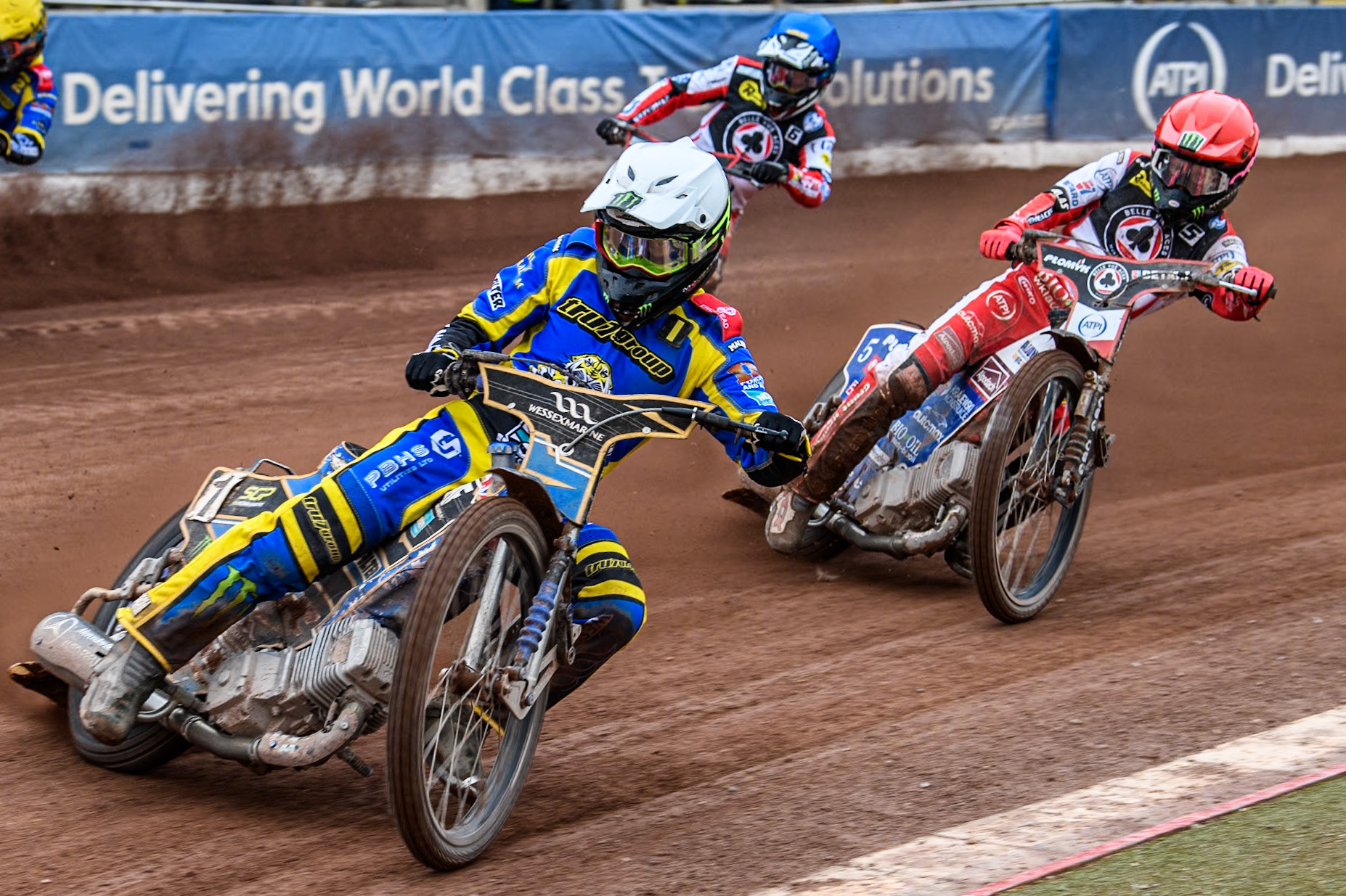 Sheffield Tigers' Jack Holder (White) leads  Belle Vue ATPI Aces Dan Bewley (Red) and Belle Vue ATPI Aces Connor Mountain (Blue) during the Rowe Motor Oil Premiership KO Cup Quarter Final 1st Leg between Belle Vue Aces and Sheffield Tigers at the National Speedway Stadium, Manchester on Monday 1st April 2024. (Photo: Ian Charles | MI News)