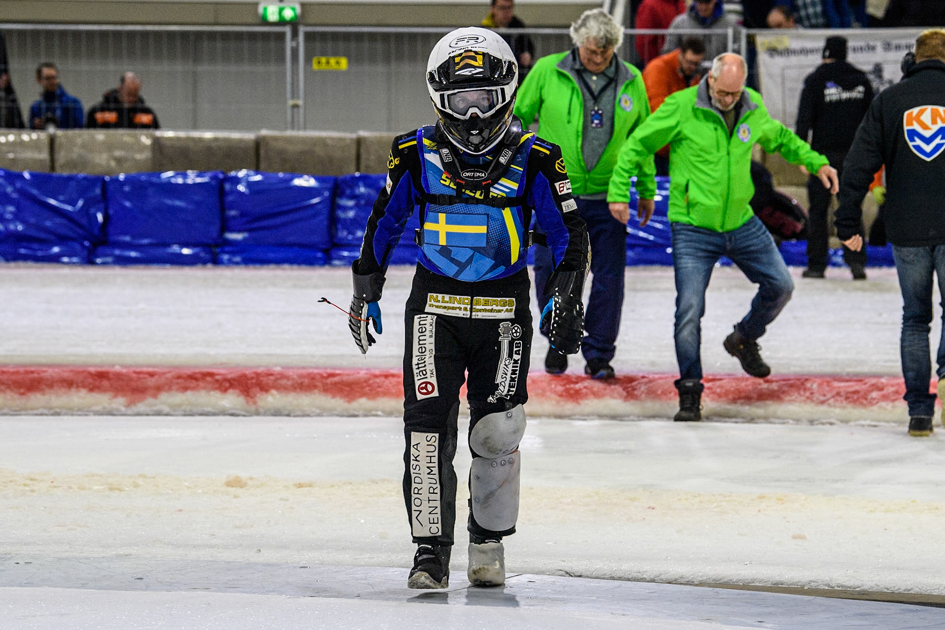 Sweden's Martin Haarahiltunen (199)  walks back to the pits after his fall during the FIM Ice Speedway Gladiators World Championship Final 4 at Ice Rink Thialf, Heerenveen on Sunday 7th April 2024. (Photo: Ian Charles | MI News)