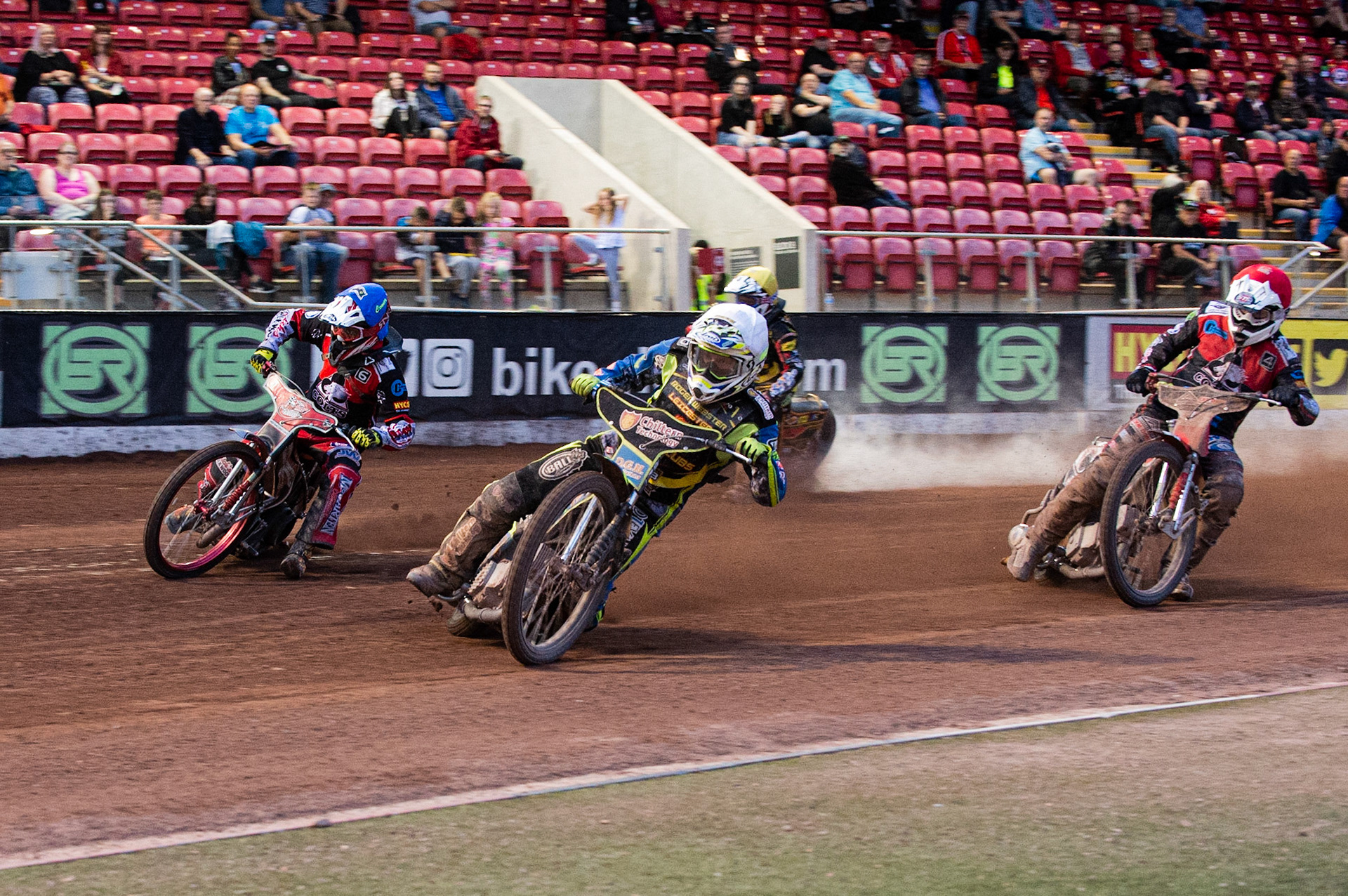Photo: Ian Charles

Danyon Hume (White) inside Connor Bailey (Blue) with Dan Thomson (Yellow) and Danny Phillips (Red) behind

Belle Vue Colts v Leicester Cubs, SGB National League, Belle Vue National Speedway Stadium, Manchester, Thursday 8  August  2019