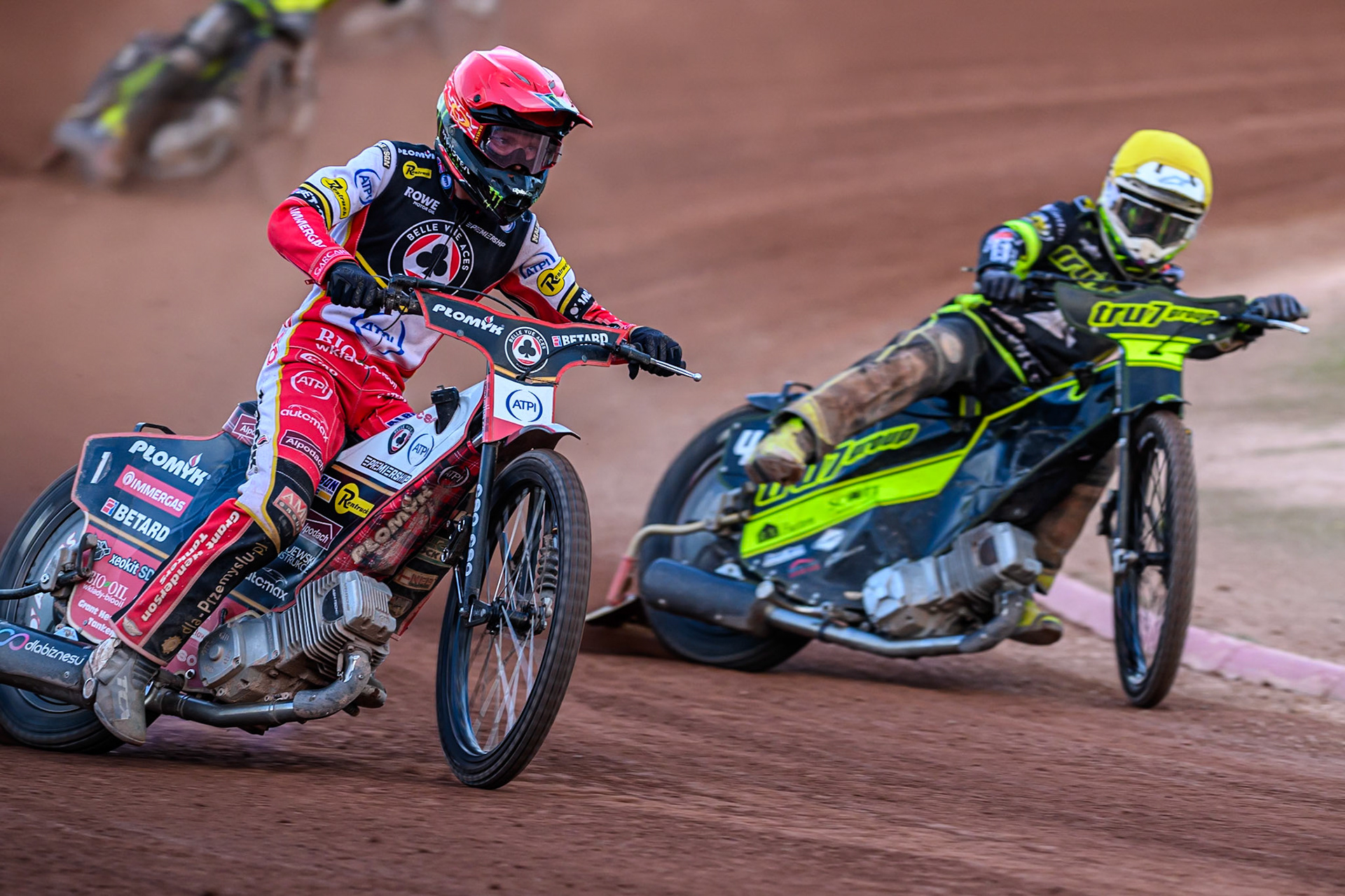 Belle Vue Aces' Dan Bewley  in Red rides outside Ipswich Witches' Tom Brennan  in Yellow during the Rowe Motor Oil Premiership match between Belle Vue Aces and Ipswich Witches at the National Speedway Stadium, Manchester on Monday 30th June 2025. (Photo: Ian Charles | MI News)