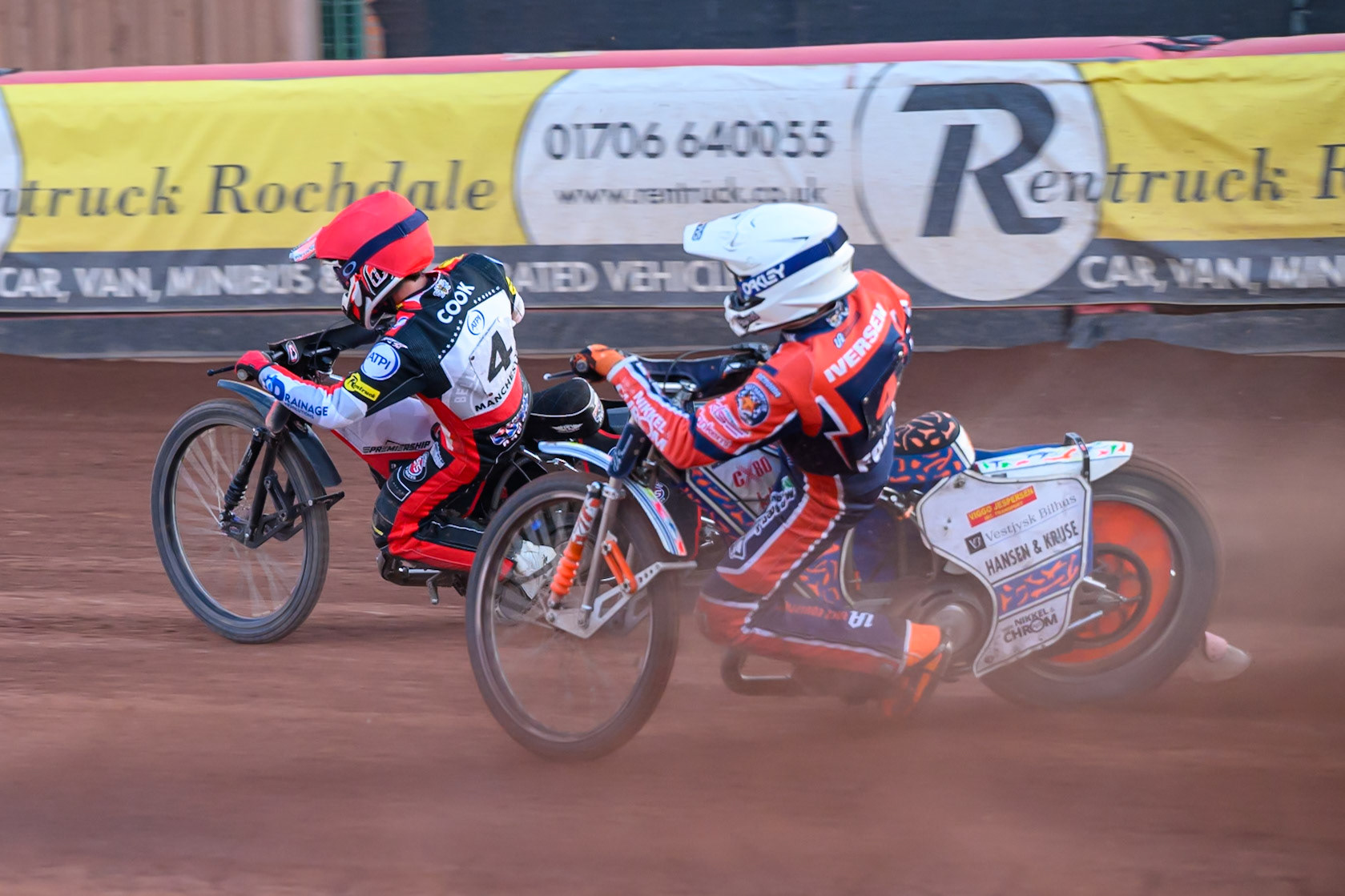 Niels-Kristian Iversen of Northampton Foxes in White chases Zach Cook of Belle Vue Aces in Red during the Rowe Motor Oil Premiership match between Belle Vue Aces and Northampton Foxes at the National Speedway Stadium, Manchester on Monday 13th July 2026. (Photo: Ian Charles | MI News)