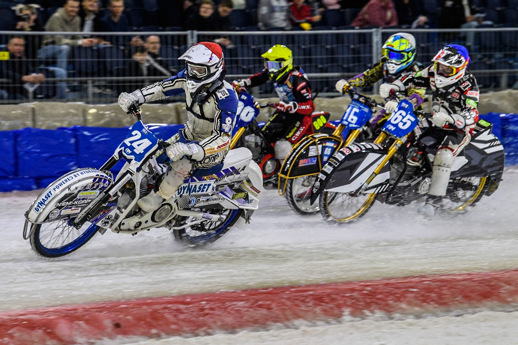 Finland's Max Koivula (24) in Red leading Austria's Charly Ebner (665) in Blue, Germany's Maximillian Neidermaier (16) in White and Netherlands' Jasper Iwema (800) in Yellow during the FIM Ice Speedway Gladiators World Championship Final 4 at Ice Rink Thialf, Heerenveen on Sunday 7th April 2024. (Photo: Ian Charles | MI News)