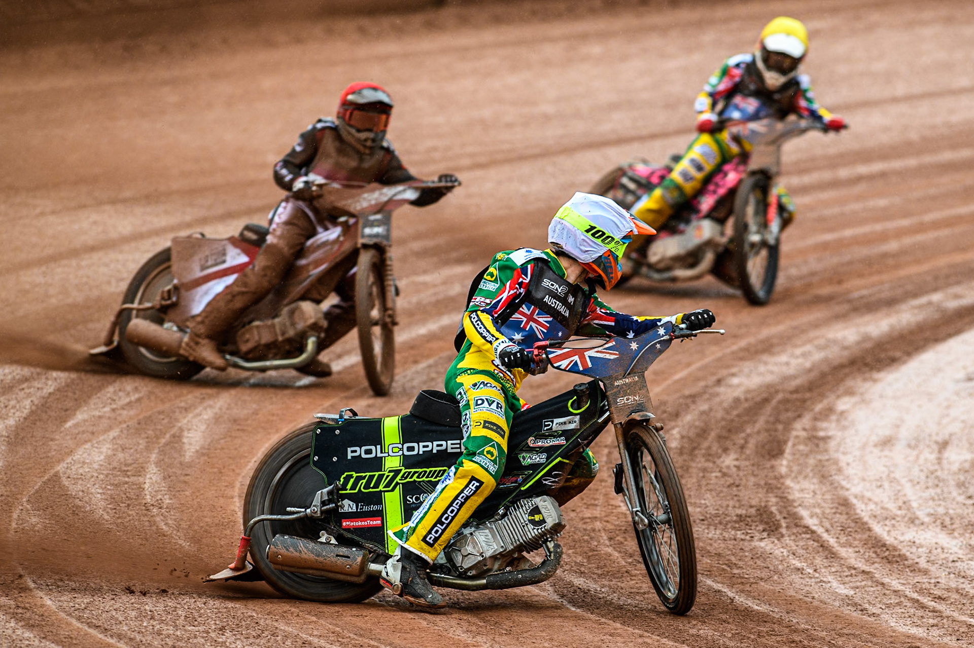 Keynan Rew of Australia in White leading Nikita Kaulins of Latvia in Red and James Pearson of Australia in Yellow during the Monster Energy FIM Speedway of Nations 2 (Under 21) Final at the National Speedway Stadium, Manchester on Friday 12th July 2024. (Photo: Ian Charles | MI News)