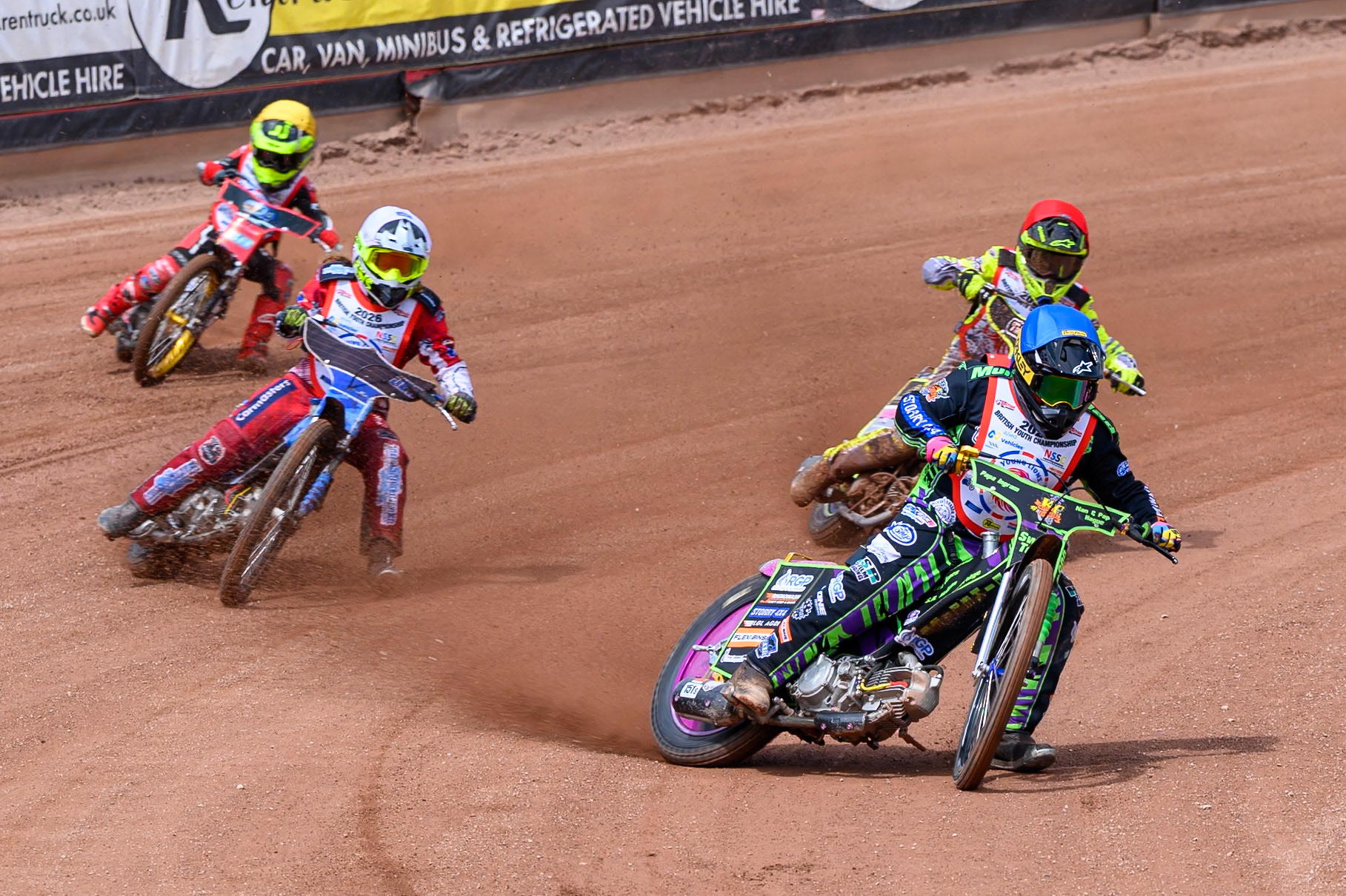 BRITISH YOUTH CHAMPIONSHIP 125cc Lewis Hague (322) in Blue Ella Marshall (12) in White, George Climo (83) in Red and Oscar Berwick (68) in Yellow leading during the British Youth Championship (125cc) at the National Speedway Stadium, Manchester on Sunday 19th July 2026. (Photo: Ian Charles | MI News)