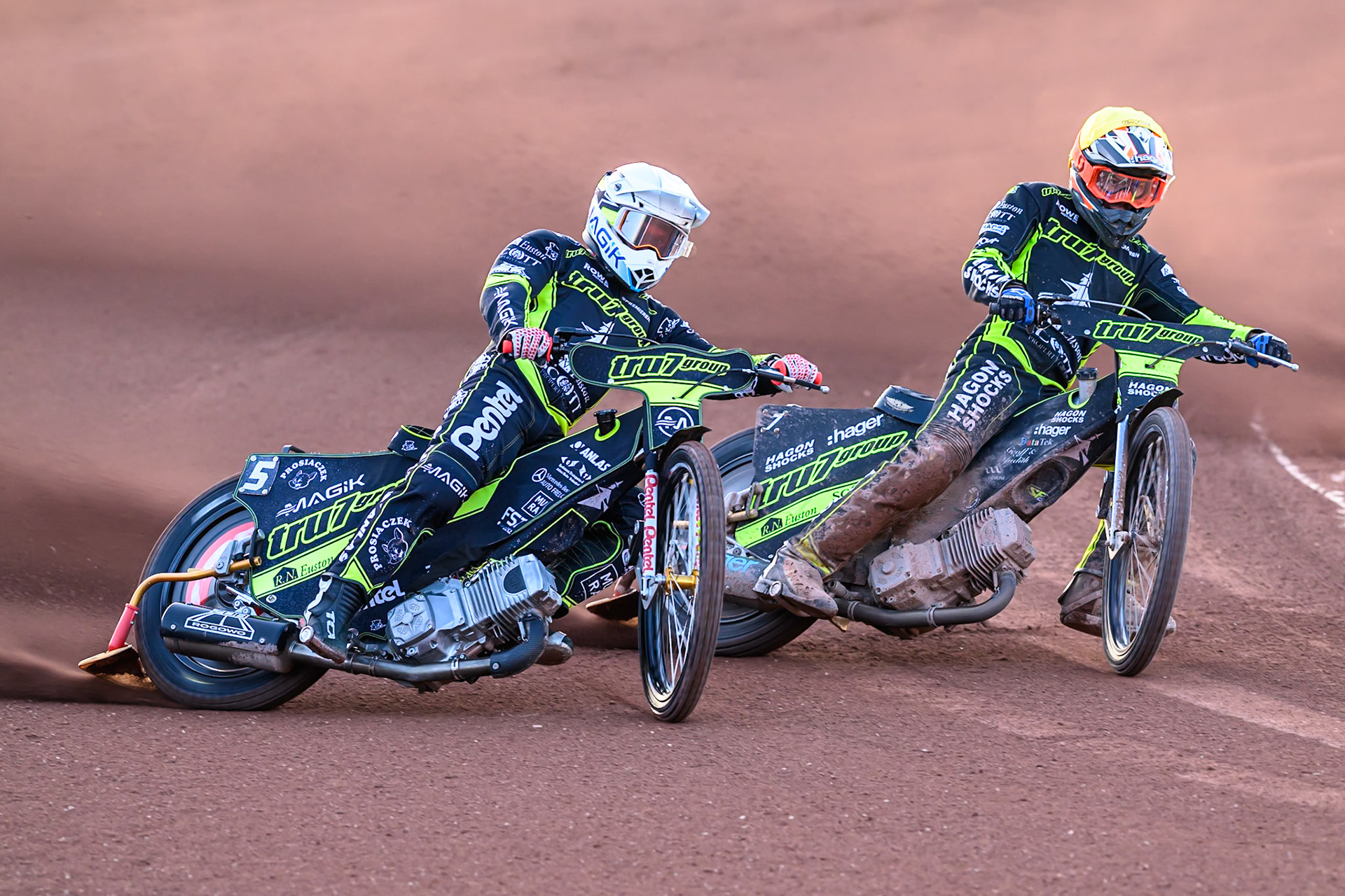Emil Sayfutdinov of Ipswich Witches  in White rides outside team mate Jason Edwards of Ipswich Witches  in Yellow during the Rowe Motor Oil Premiership match between Belle Vue Aces and Ipswich Witches at the National Speedway Stadium, Manchester on Monday 4th August 2025. (Photo: Ian Charles | MI News)