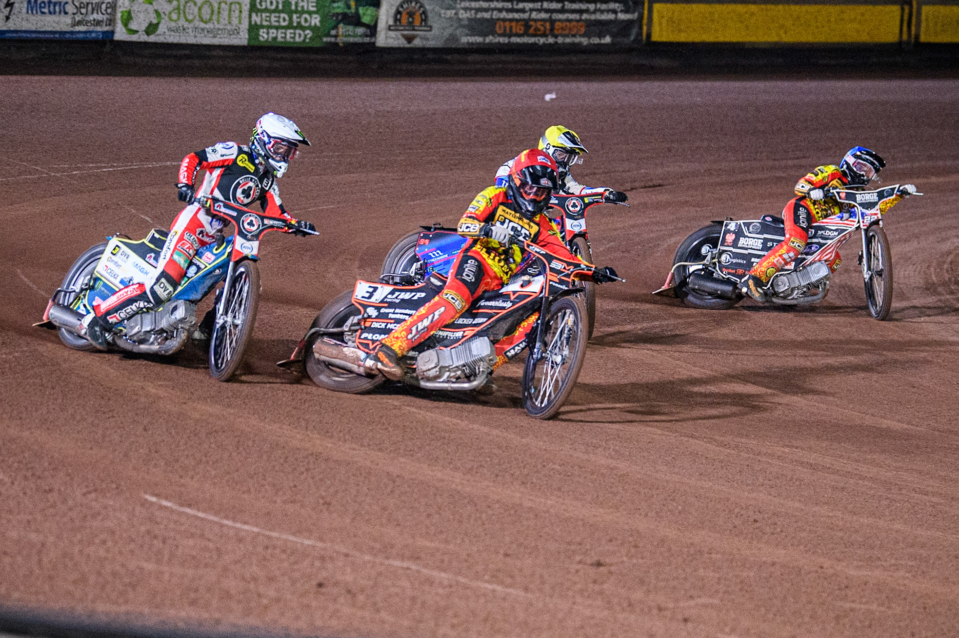 Leicester Lions' Sam Masters in Red leading Belle Vue Aces' Jaimon Lidsey in White, Belle Vue Aces' Ben Cook in Yellow and Leicester Lions' Luke Becker in Blue during the Rowe Motor Oil Premiership Grand Final 2nd Leg between Leicester Lions and Belle Vue Aces at the Pidcock Motorcycles Arena, Leicester on Thursday 26th September 2024. (Photo: Ian Charles | MI News)