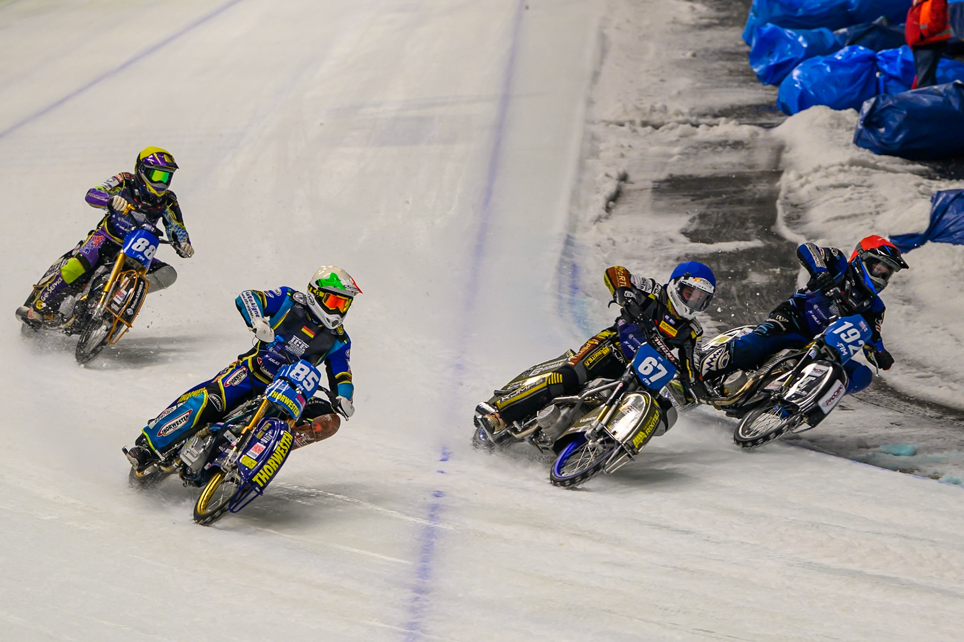Last Chance Heat: Niclas Svensson (192) of Sweden  in Red rides inside Heikki Huusko (67) of Finland  in Blue and Luca Bauer (85) of Italy/Germany  in White with Max Niedermaier (88) of Germany in Yellow behind during the Ice Speedway Gladiators World Championship Final 1 at Max-Aicher-Arena, Inzell on Saturday 14th March 2026. (Photo: Ian Charles | MI News)
