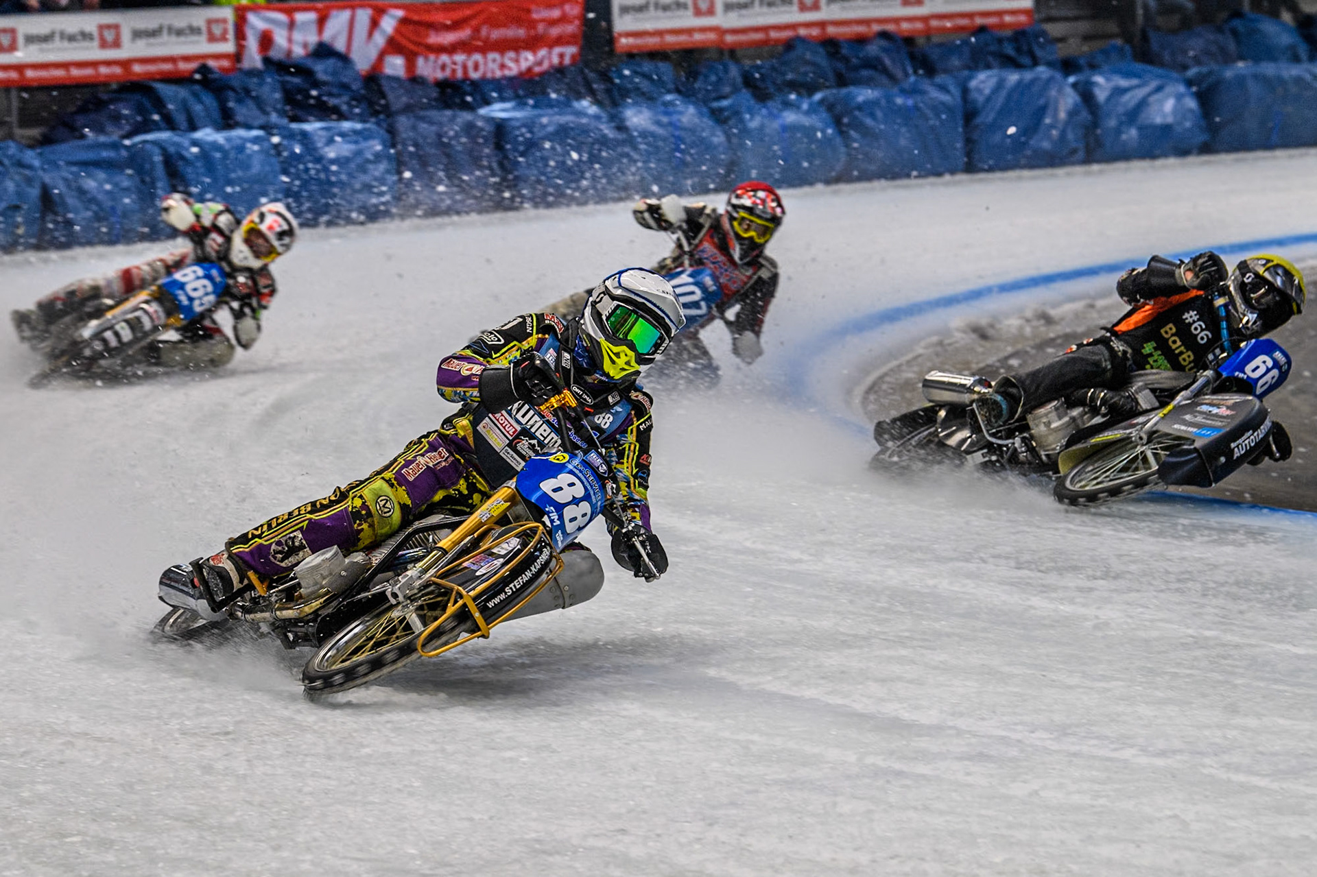 Germany's Max Niedermaier (88) (Blue) outside Finland's Aki Ala-Riihimäki (66) (Yellow) with Austria's Charly Ebner (665) (White) and Czech Republic's Andrej Diviš (107) (Red) behind during the FIM Ice Speedway Gladiators World Championship Final 2 at the Max-Aicher-Arena, Inzell on Sunday 24 March 2024. (Photo: Ian Charles | MI News)