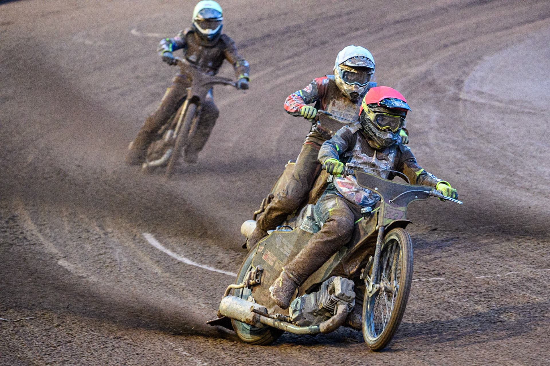 Tom Brennan (Red) leads Danyon Hulme (White) and Joe Thompson (Yellow) during the Sports Insure British Speedway Final at the National Speedway Stadium, Manchester on Monday 14th August 2023. (Photo: Ian Charles | MI News)