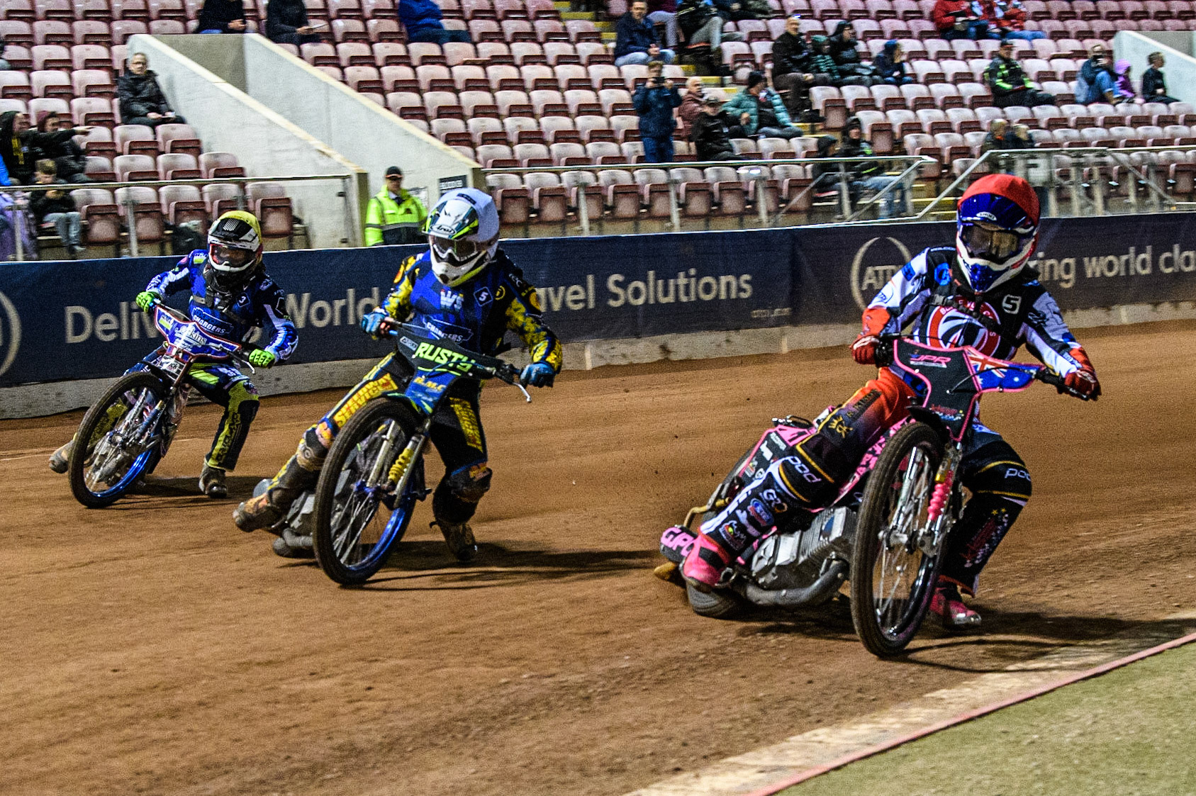 James Pearson  (Red) inside Henry Atkins  (White) and Ryan Kinsley  (Yellow) during the National Development League match between Belle Vue Colts and Oxford Chargers at the National Speedway Stadium, Manchester on Friday 12th May 2023. (Photo: Ian Charles | MI News)