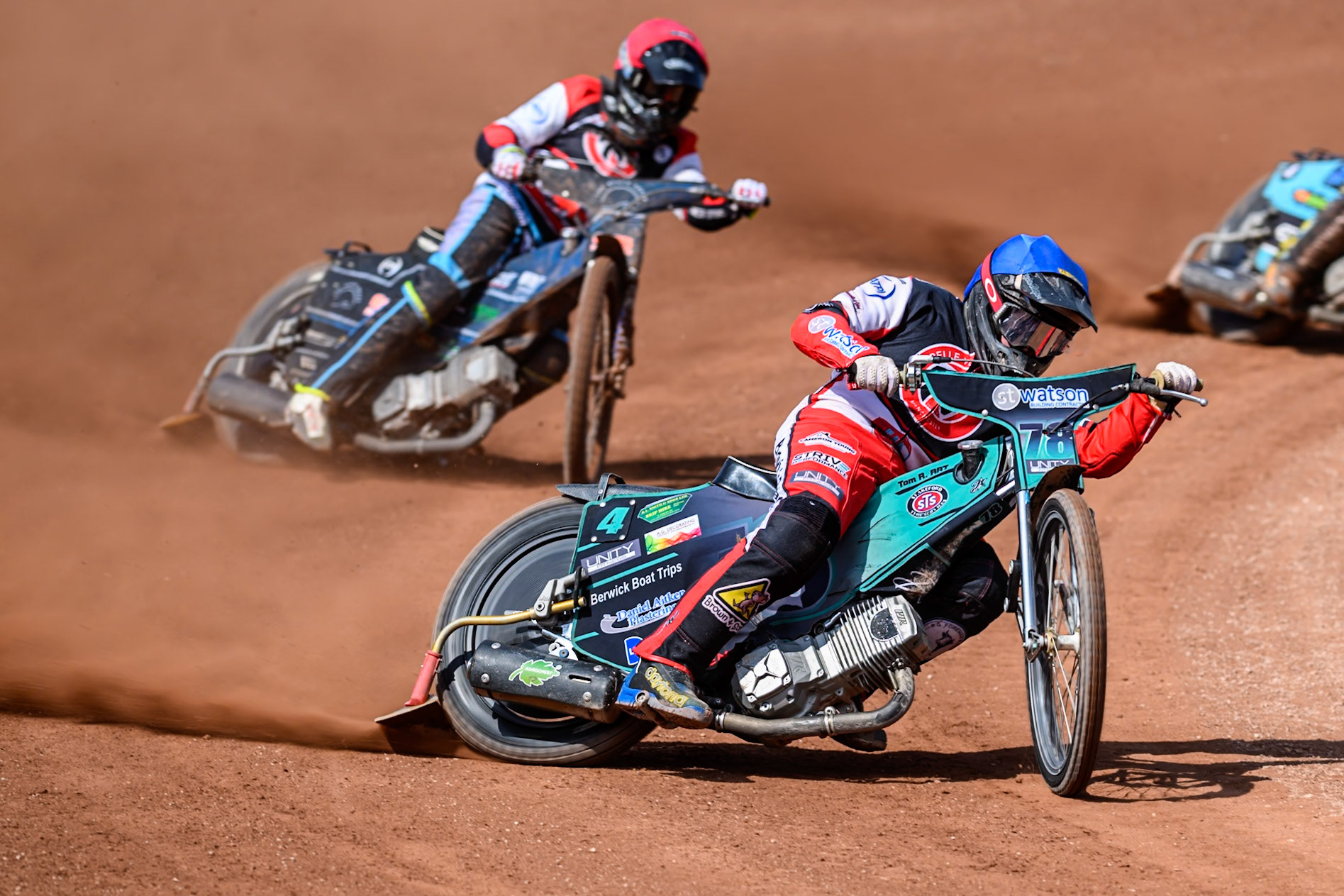 Mason Watson of Belle Vue Colts  in Blue leading Jack Kingston of Belle Vue Colts  in Red during the WSRA National Development League match between Belle Vue Colts and Middlesbrough Tigers at the National Speedway Stadium, Manchester on Sunday 10th August 2025. (Photo: Mark Fletcher | MI News)