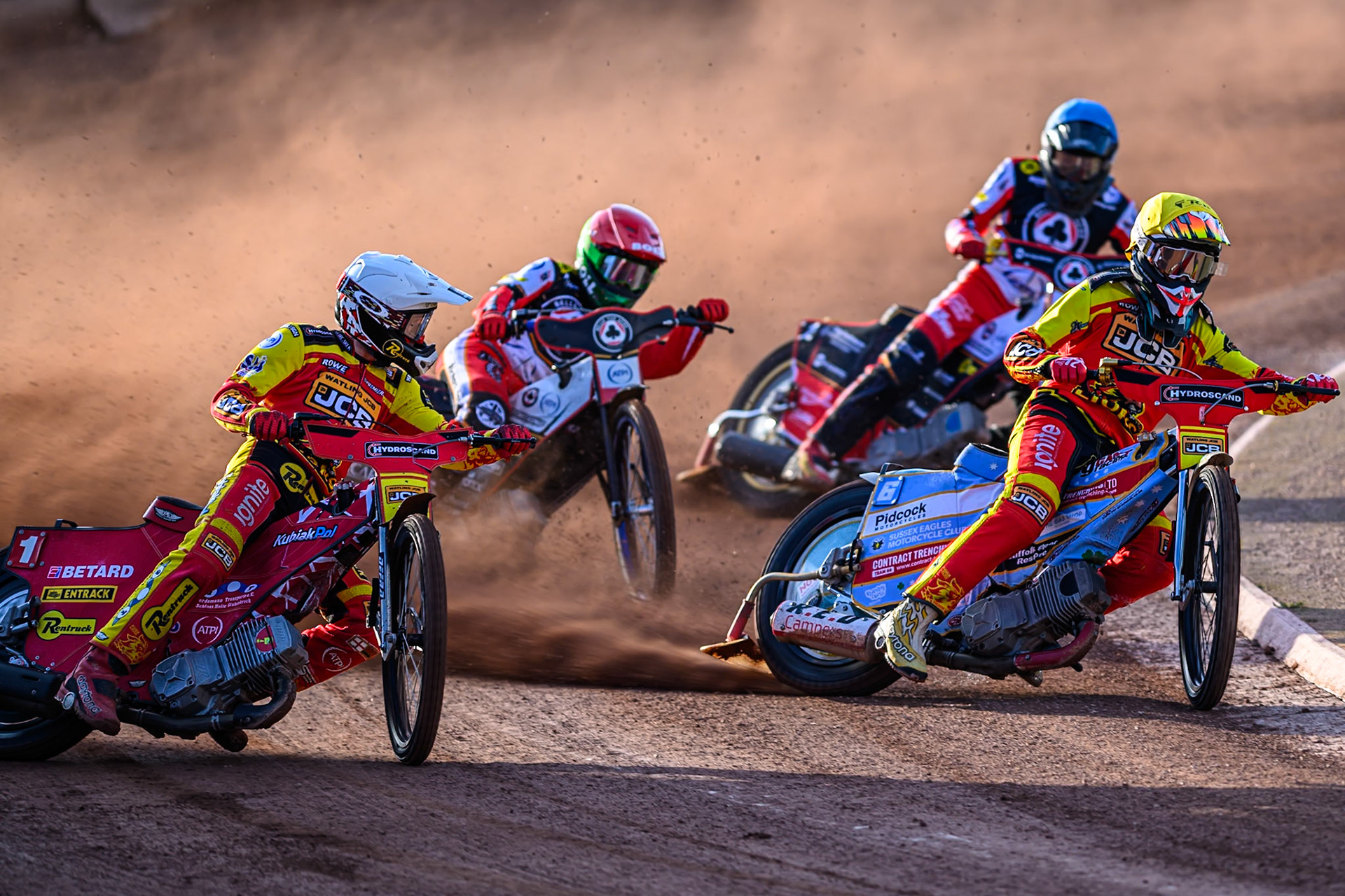 Leicester Lions' Max Fricke  in White and Leicester Lions' Drew Kemp  in Yellow leading Belle Vue Aces' Brady Kurtz in Red and Belle Vue Aces' Norick Blödorn in Blue during the Rowe Motor Oil Premiership match between Belle Vue Aces and Leicester Lions at the National Speedway Stadium, Manchester on Monday 14th July 2025. (Photo: Ian Charles | MI News)