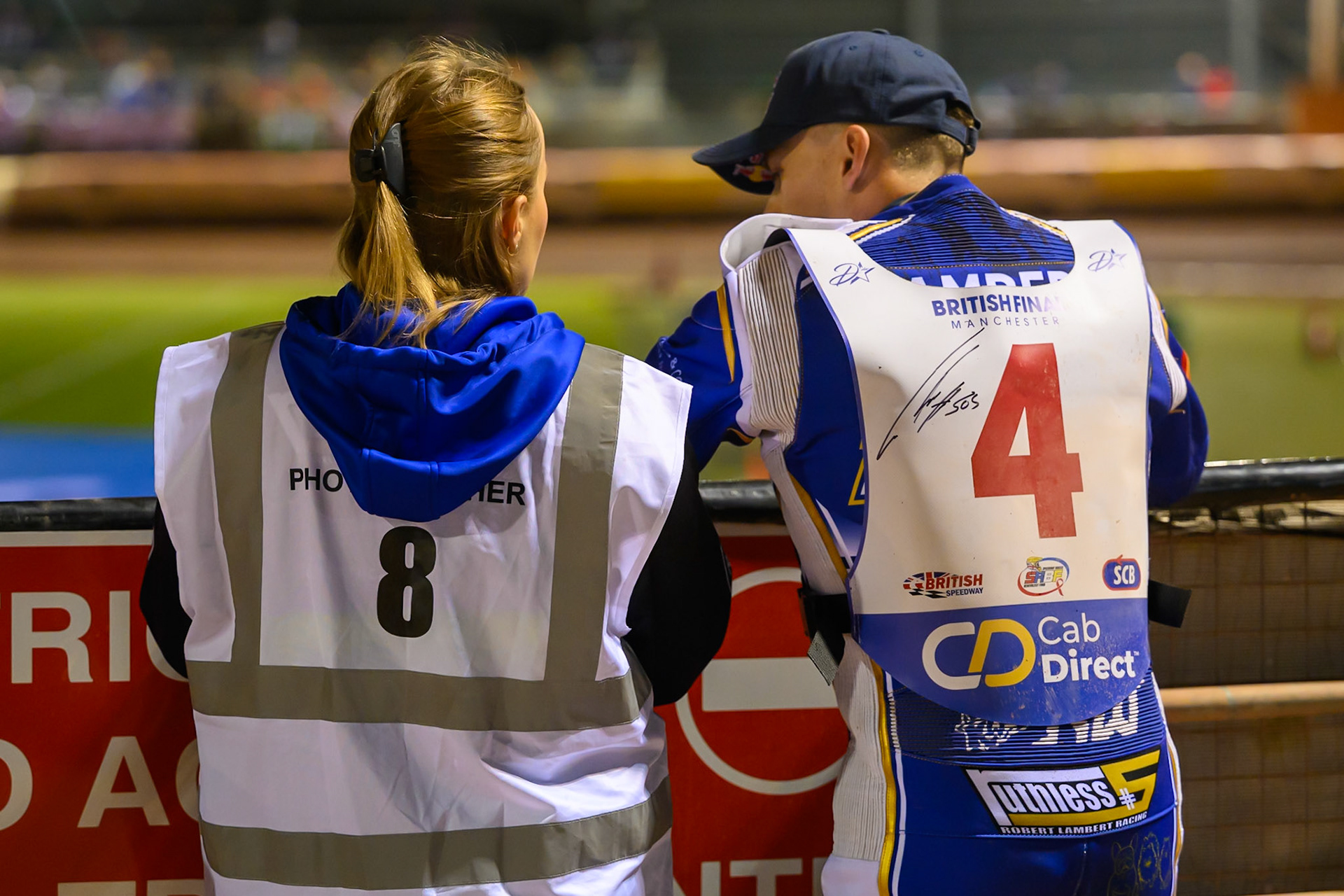 Robert Lambert (4) (Right) watches the track prep with his wife Julia during the Cab Direct British Speedway Championship Final at the National Speedway Stadium, Manchester on Saturday 15th August 2026. (Photo: Ian Charles | MI News)