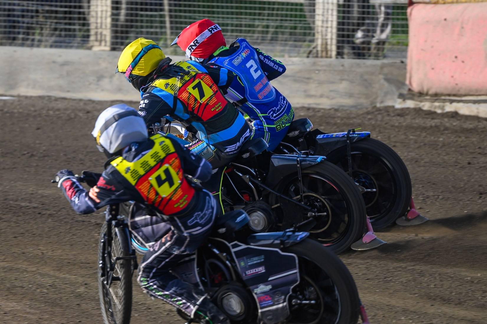Seth Norman of Leicester Lion Cubs   in White chases Eli Meadows  of Leicester Lion Cubs  in Yellow and Arran Butcher of Buxton Bulls   in Red during the WSRA National Development League match between Buxton Bulls and Leicester Lion Cubs at Hi-Edge Speedway, Buxton on Sunday 4th October 2026. (Photo: Ian Charles | MI News)