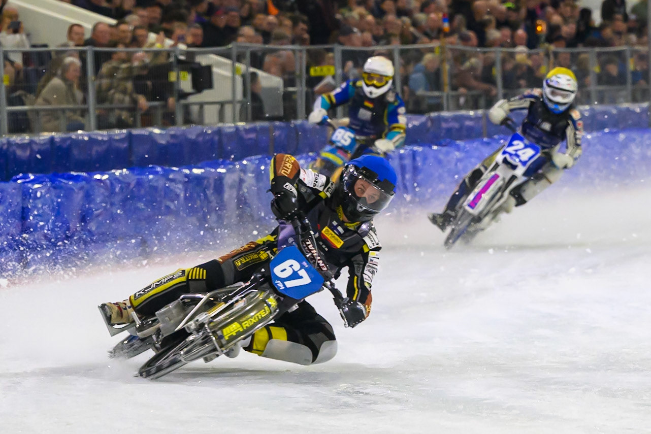 Heikki Huusko (67) of Finland  in Blue leading Luca Bauer (85) of Italy/Germany in White and Max Koivula (24) of Finland  in Yellow during the FIM Ice Speedway Gladiators World Championship Final 3 at Ice Rink Thialf, Heerenveen on Saturday 11th April 2026. (Photo: Ian Charles | MI News)