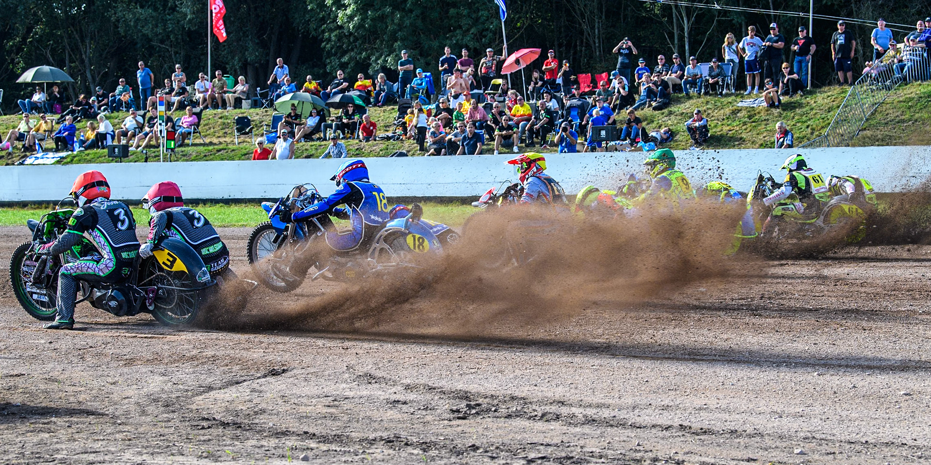 the restart of the fourth sidecar heat: (L to R) Josh &amp; Scott Goodwin (3) of Great Britain  in Red, Kenny Van Eeckhout &amp; Axelle Cannaerts (18) of Belgium in Blue, Clement &amp; Romain Furet (32) of France in Yellow, Mitch Goddard &amp; Paul Smith (9) of Great Britain in Green  and Joachim Martens &amp; Des Vanzonhoven (61) of Belgium in Black &amp; White in the Sidecar Support Class during the FIM Long Track World Championship Final 5 at the Speed Centre Roden, Roden, Netherlands on Sunday 22nd September 2024. (Photo: Ian Charles | MI News)
