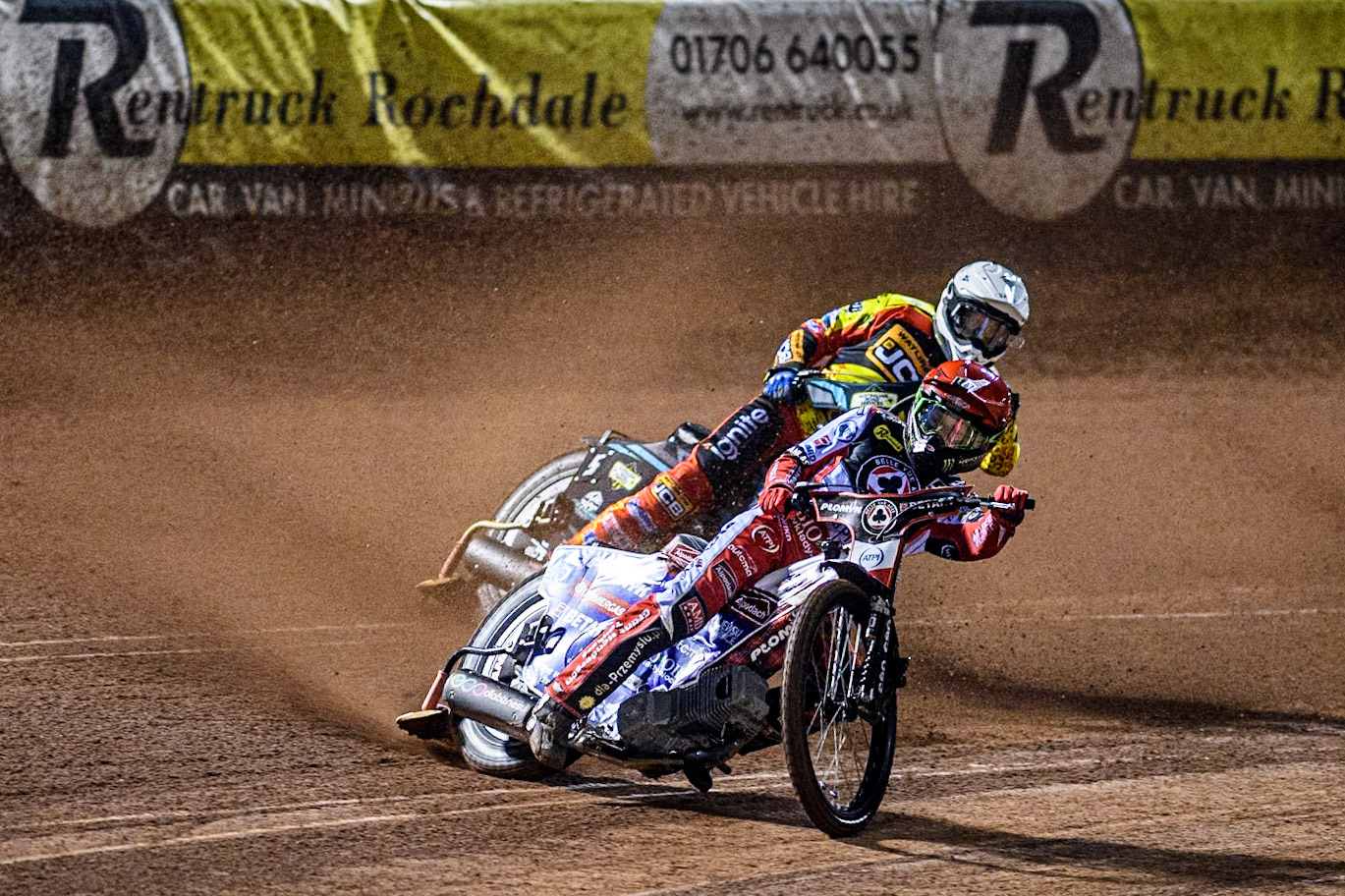 Belle Vue Aces' Dan Bewley  in Red leading Leicester Lions' Ryan Douglas  in White during the Rowe Motor Oil Premiership Grand Final 1st Leg between Belle Vue Aces and Leicester Lions at the National Speedway Stadium, Manchester on Monday 23rd September 2024. (Photo: Ian Charles | MI News)