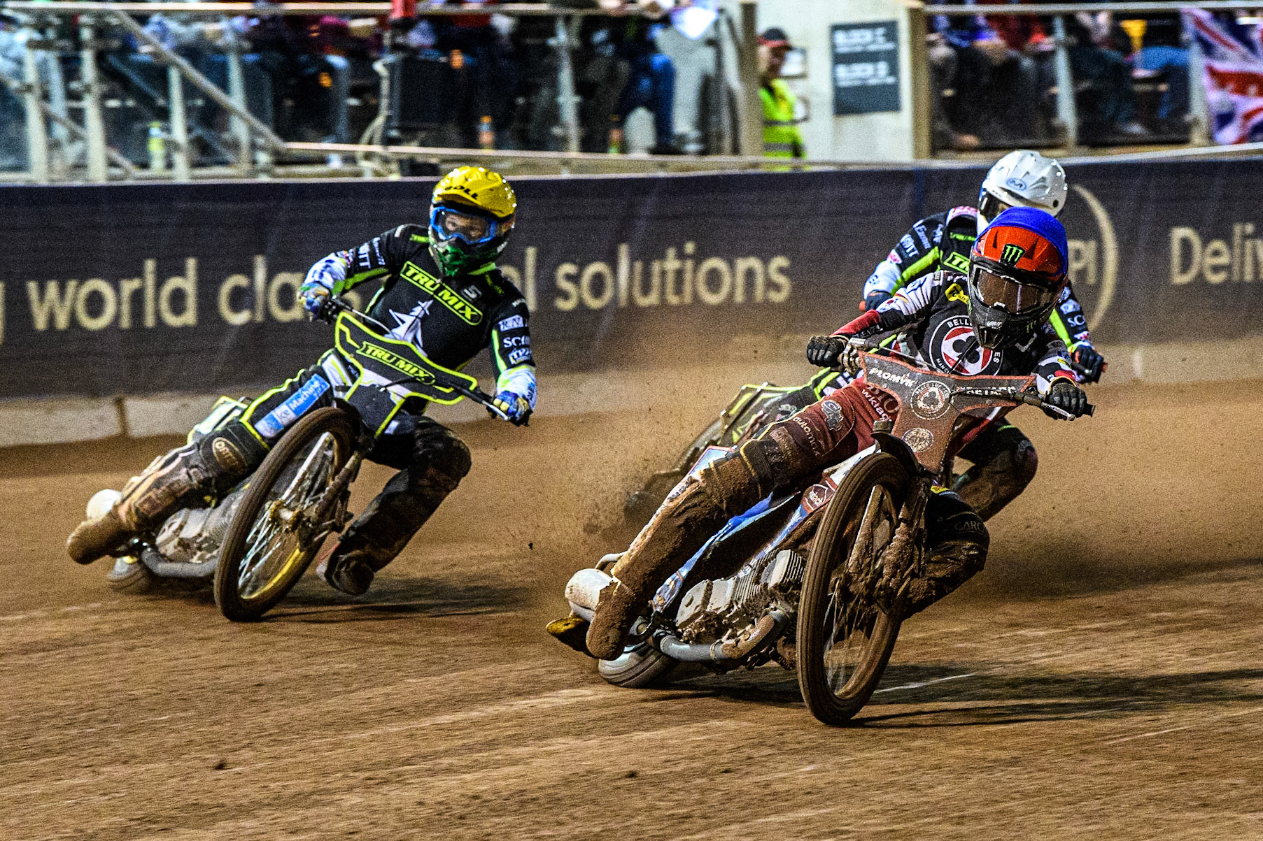 Dan Bewley (Blue) leads  Jason Doyle (Yellow) and Emil Sayfutdinov  (White) during the Sports Insure Premiership Semi Final Playoff 2nd leg match between Belle Vue Aces and Ipswich Witches at the National Speedway Stadium, Manchester on Monday 25th September 2023. (Photo: Ian Charles | MI News)