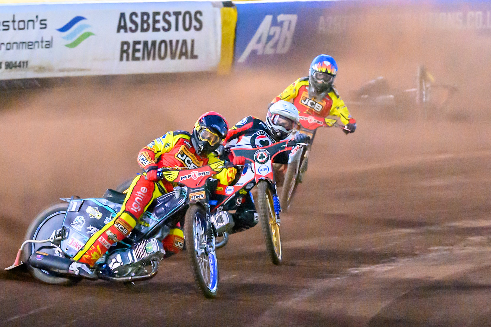 Ryan Douglas of Leicester Lions in Red leading Jason Doyle of Belle Vue Aces  in White  and Drew Kemp of Leicester Lions in Blue  as Tate Zischke of Belle Vue Aces  in Yellow  falls behind them during the Rowe Motor Oil Premiership match between Leicester Lions and Belle Vue Aces at the Hydroscan Arena, Leicester on Monday 7th September 2026. (Photo: Ian Charles | MI News)