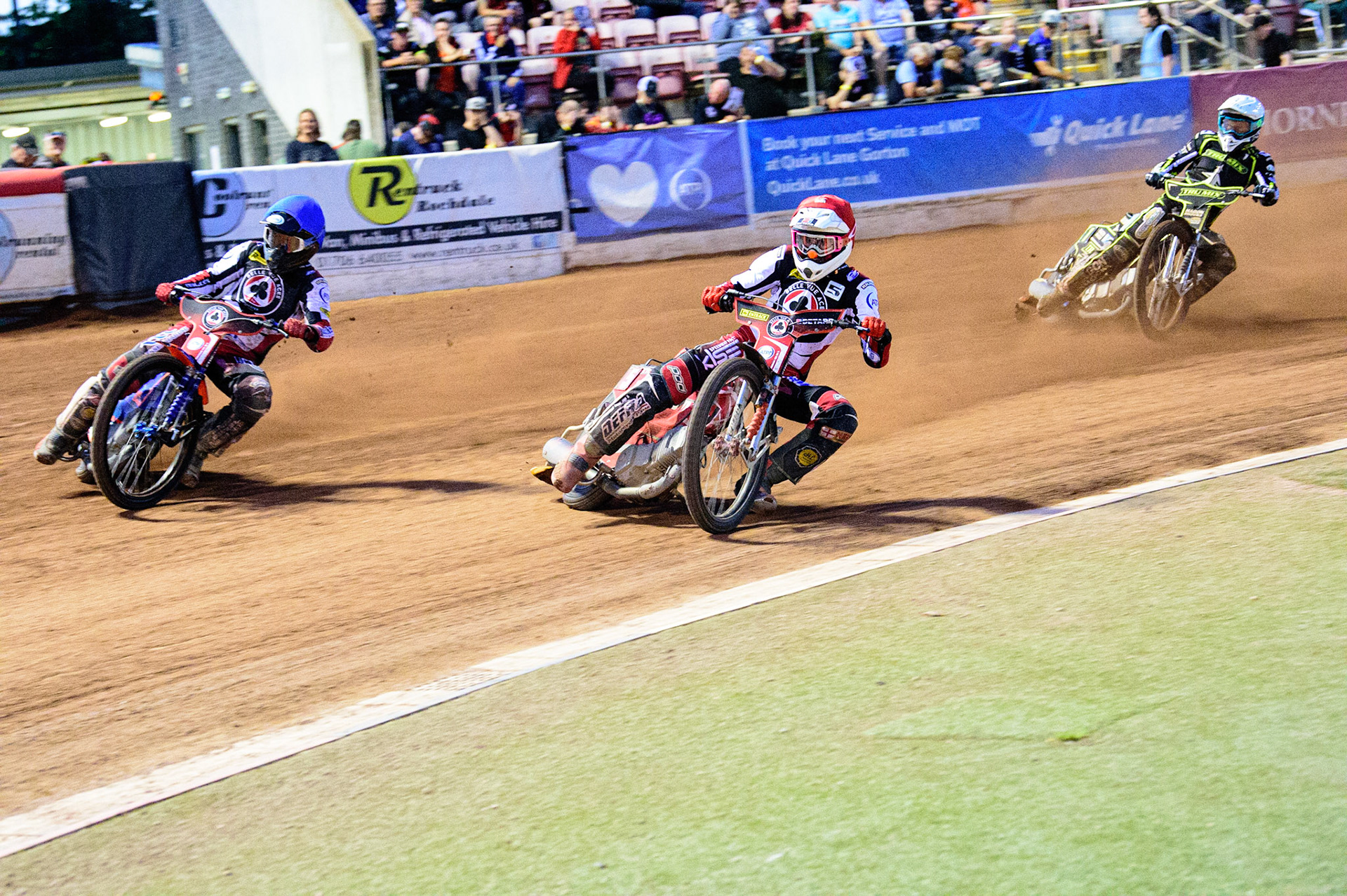 Brady Kurtz  (Blue) and Max Fricke  (Red) go for maximum points ahead of Jason Doyle  (White) during the SGB Premiership match between Belle Vue Aces and Ipswich Witches at the National Speedway Stadium, Manchester on Monday 8th August 2022. (Credit: Ian Charles | MI News)