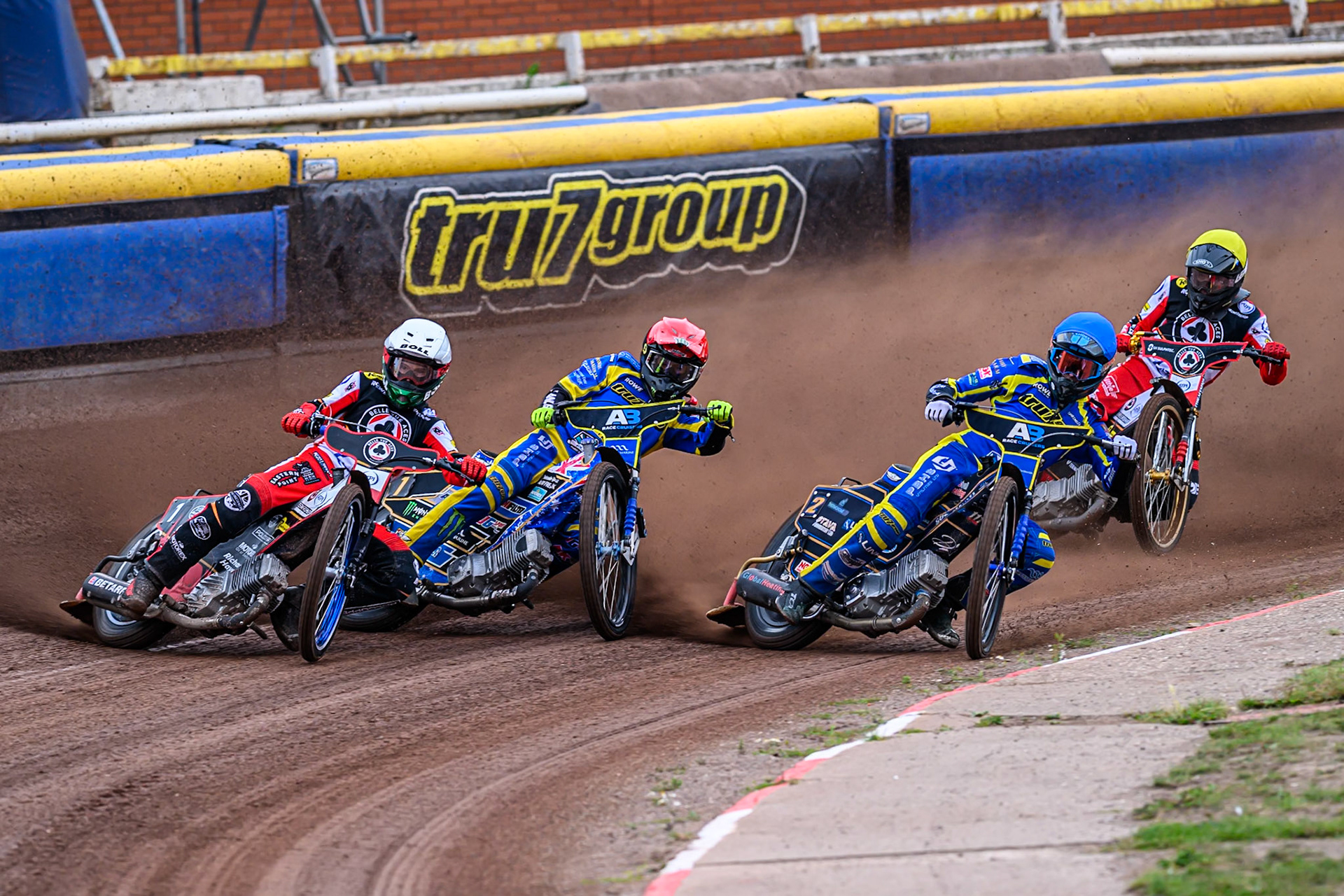 Brady Kurtz of Belle Vue Aces   in White rides outside Jack Holder of Sheffield Tigers  in Red, Anders Rowe of Sheffield Tigers , in Blue and Norick Blodorn of Belle Vue Aces   in Yellow during the Rowe Motor Oil Premiership match between Sheffield Tigers and Belle Vue Aces at Owlerton Stadium, Sheffield on Monday 11th August 2025. (Photo: Ian Charles | MI News)
