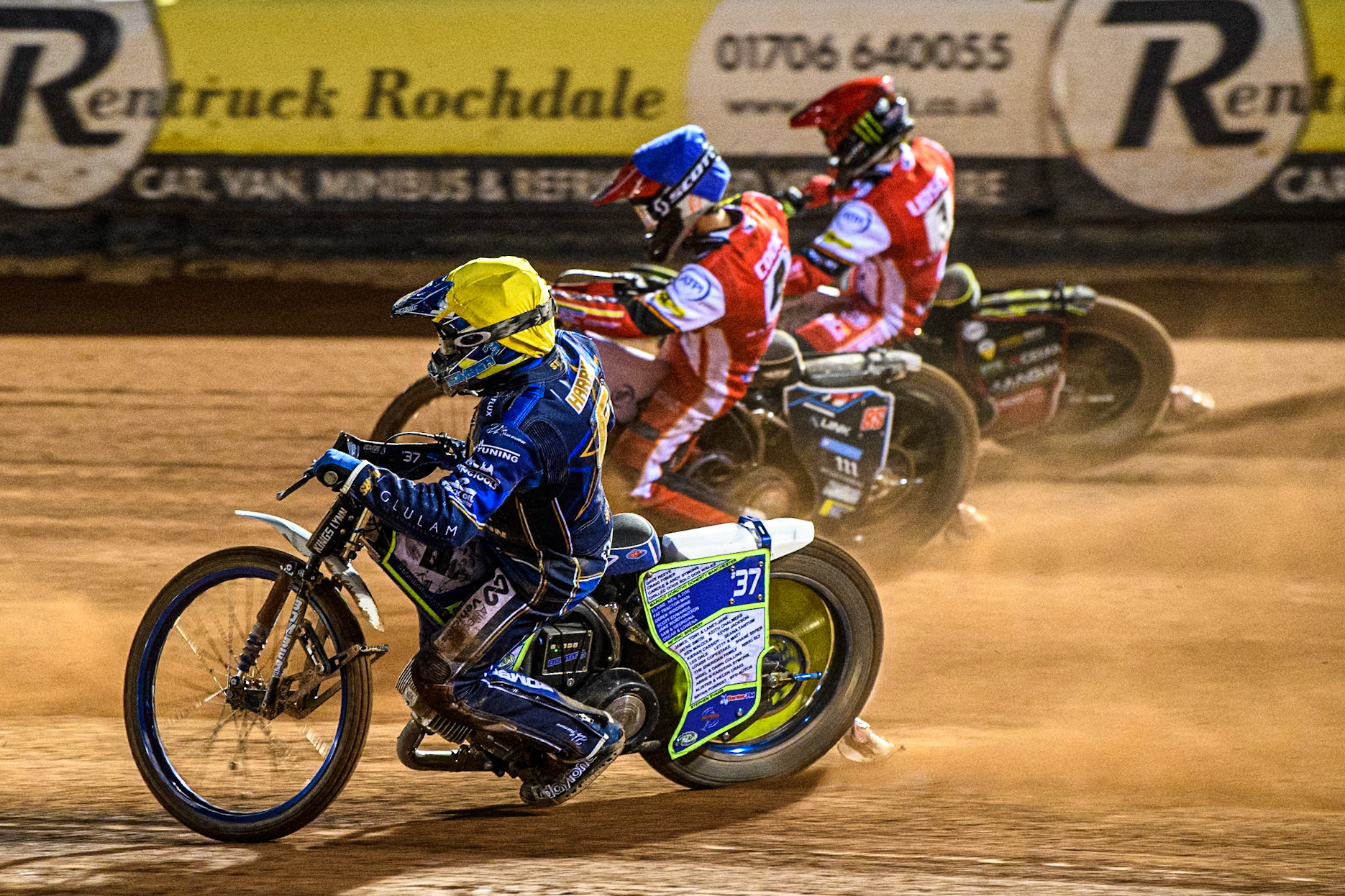 Chris Harris of Kings Lynn Stars in Yellow \i\ Zach Cook of Belle Vue Aces in Blue and Jaimon Lidsey of Belle Vue Aces in Red during the Rowe Motor Oil Premiership match between Belle Vue Aces and King's Lynn Stars at the National Speedway Stadium, Manchester on Monday 5th April 2025. (Photo: Ian Charles | MI News)