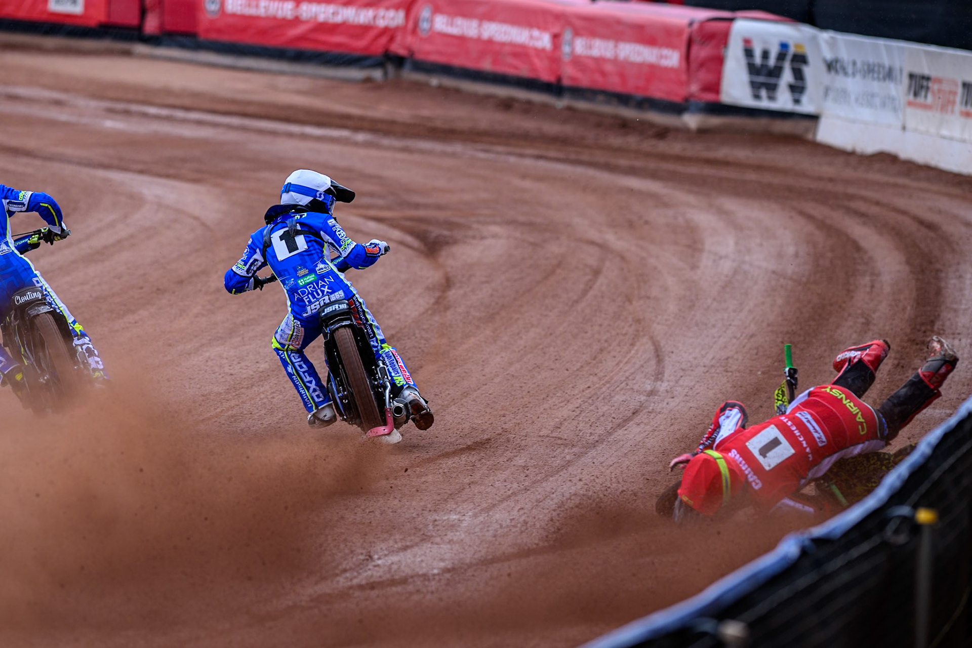 Belle Vue Colts' William Cairns falls whilst trying to pass Oxford Chargers' Jody Scott  in White and Oxford Chargers' Jacob Clouting  in Yellow during the WSRA National Development League match between Belle Vue Colts and Oxford Chargers at the National Speedway Stadium, Manchester on Sunday 1st June 2025. (Photo: Ian Charles | MI News)