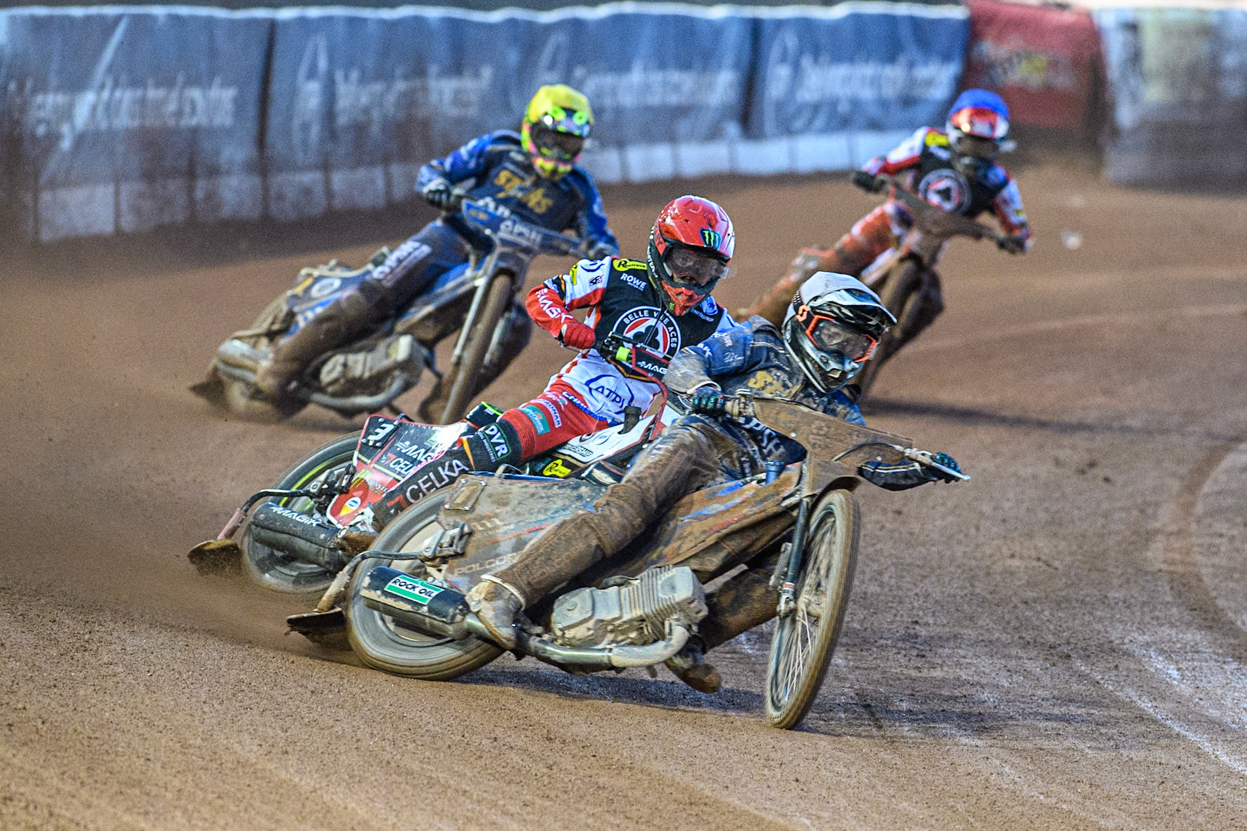 Ben Cook of Kings Lynn Stars in White leading Jaimon Lidsey of Belle Vue Aces in Red Richard Lawson of Kings Lynn Stars in Yellow and Zach Cook of Belle Vue Aces in Blue during the Rowe Motor Oil Premiership match between Belle Vue Aces and King's Lynn Stars at the National Speedway Stadium, Manchester on Monday 5th April 2025. (Photo: Ian Charles | MI News)
