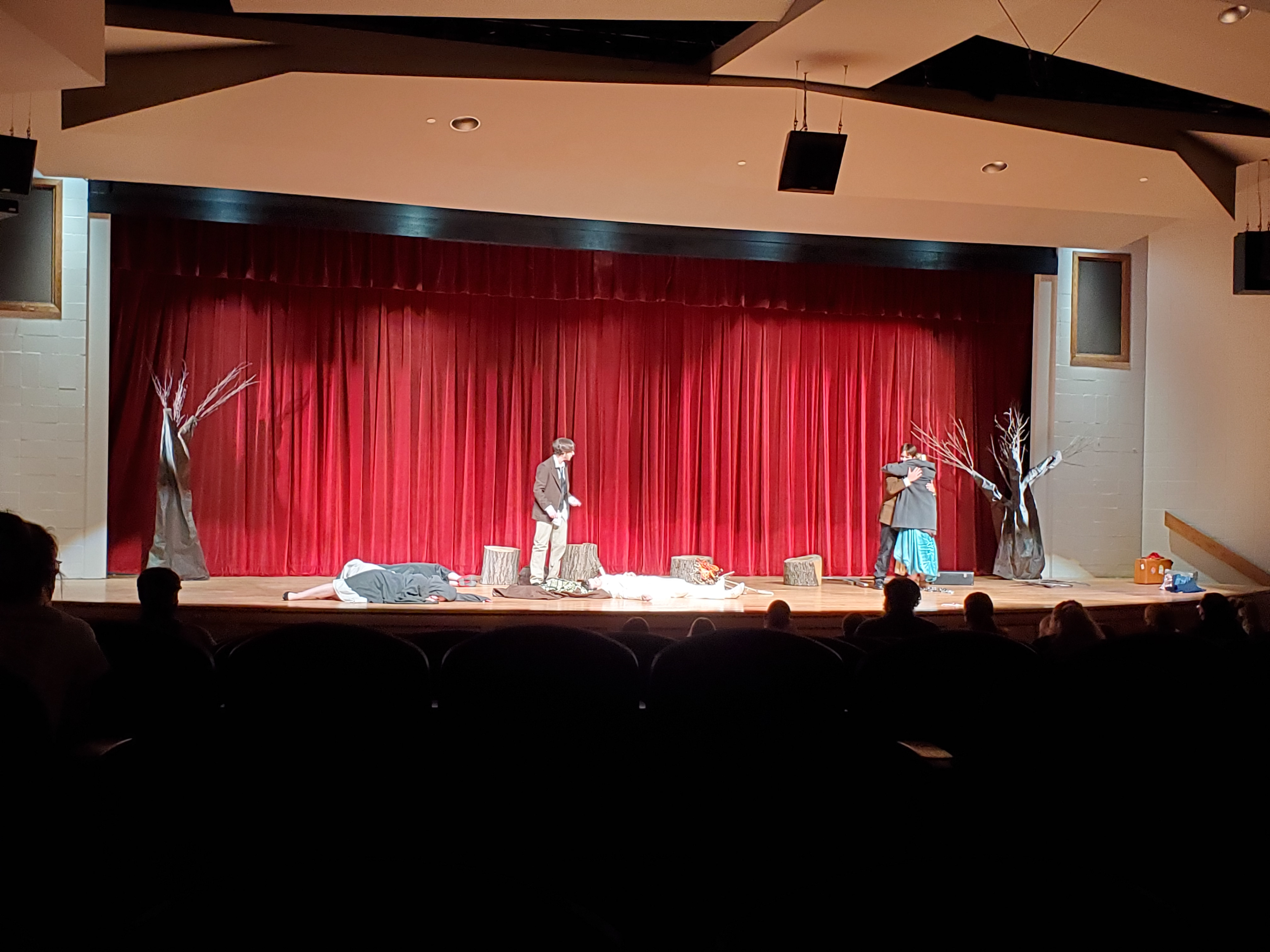 Artificial Trees built to hide entrances on either side of the stage for exterior scene