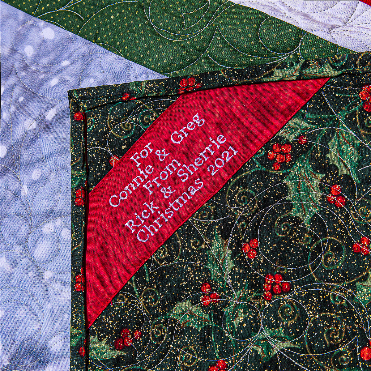 Close-up of personalized label on back of quilt