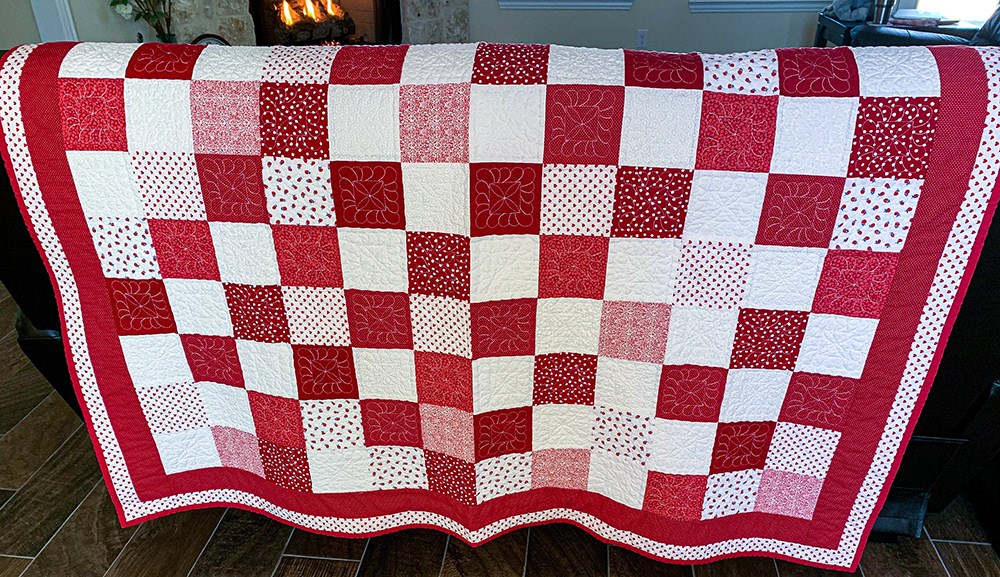 "GDaisyFast" quilt pattern from Stitch Happy on every interior block