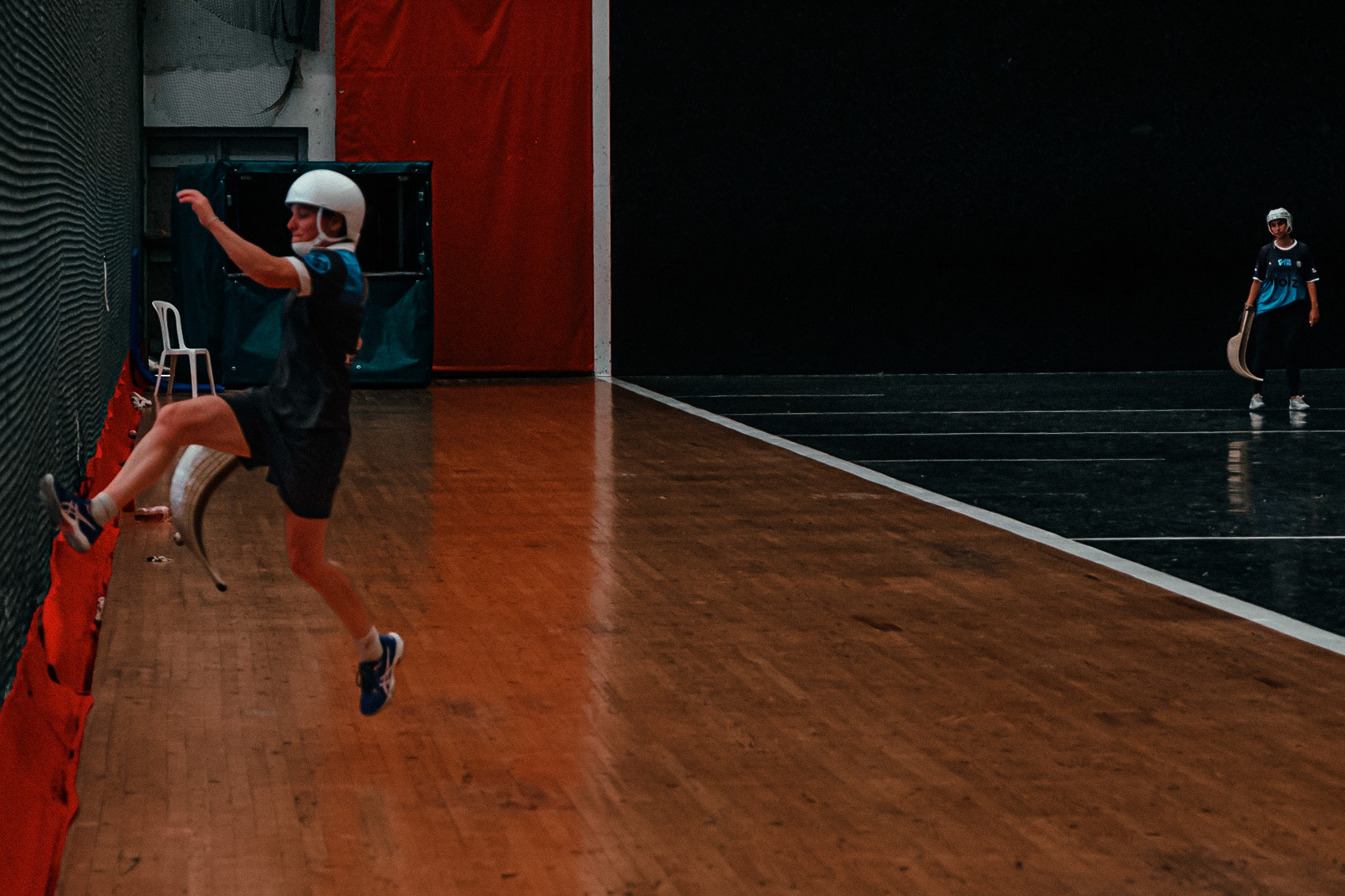 France, Bayonne, 2023-06-15. Basque pelota, a history of transmission in a sport with a long tradition. Discover the diversity of pelota with female players et with the French team's handi pelota section. Laureline relaunches the pelota using the wire mesh as a springboard. As pelotes can reach very high speeds (300 km/h in cesta punta), players wear helmets and/or goggles to protect their heads from any impact with the pelote. The game is fast, precise, strategic and highly technical. Photograph by romain de sigalas / hans lucas. France, bayonne, 2023-06-15. La pelote Basque, une histoire de transmission dans un sport de longue tradition. A la rencontre de la diversite de la pelote avec les joueuses et egalement la section handi pelote de l equipe de France. Lauréline va relancer la pelote en utilisant le grillage comme un tremplin. Les pelotes pouvant atteindre des vitesses très élevées (300 km/h en cesta punta), les joueuses sont munis de casques et/ou de lunettes afin de proteger la tete de tout impact avec la pelote. C'est un jeu rapide, precis, strategique et tres technqiue. Photographie de romain de sigalas / hans lucas.