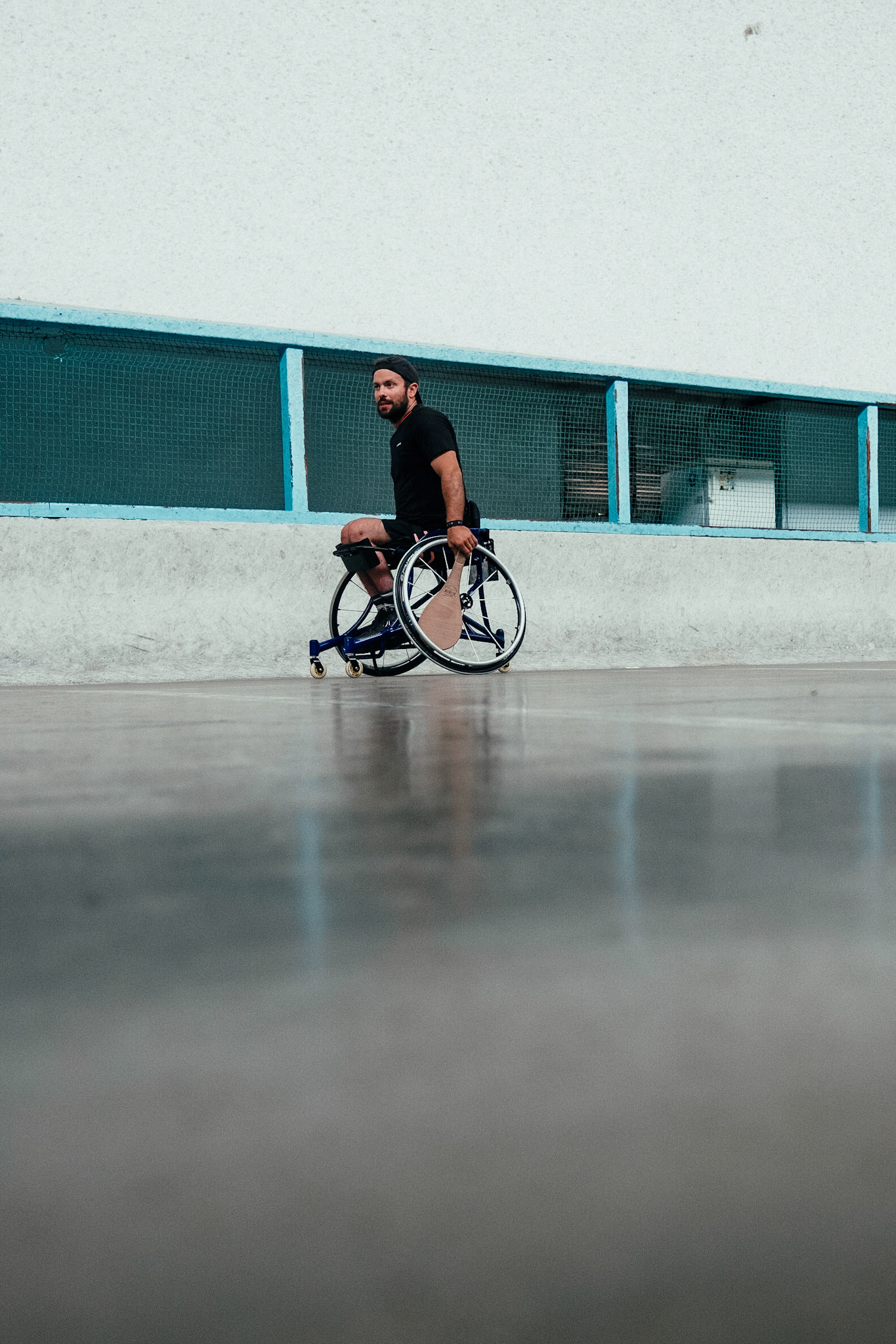 France, Bayonne, 2023-06-15. Basque pelota, a history of transmission in a sport with a long tradition. Discover the diversity of pelota with female players et with the French team's handi pelota section. Maixi Cabanne, 30, is Bayonne's first Para pelote player, having joined the Aviron Bayonnnais 7 years ago.  He has always played pelota, starting with his bare hands on the village pelota court. After a car accident at the age of 18 left him a paraplegic, Maixi began Para Surf and continued Pala in a wheelchair. In both disciplines, he is a member of the French team, and took part in the World Championships in California for surfing last December, and in Biarritz for Basque pelota in autumn 2022. Photograph by romain de sigalas / hans lucas. France, bayonne, 2023-06-15. La pelote Basque, une histoire de transmission dans un sport de longue tradition. A la rencontre de la diversite de la pelote avec les joueuses et egalement la section handi pelote de l equipe de France. Maixi Cabanne 30 ans est le premier pratiquant de la Para pelote à Bayonne, il est rentre a l aviron Bayonnnais y a 7 ans.  Il a toujours joue à la pelote en commançant par la main nue sur le fronton de son village. Apres son accident de voiture a 18 ans qui le rend paraplegique, Maixi après sa reeducation commence la Para Surf et continu la Pala en fauteuil. Sur ces deux disciplines, il fait parti de l'equipe de France et a partcipe au mondiaux de califormie pour le Surf en decembre dernier et a Biarritz pour la pelote Basque a l'automne 2022. Photographie de romain de sigalas / hans lucas.
